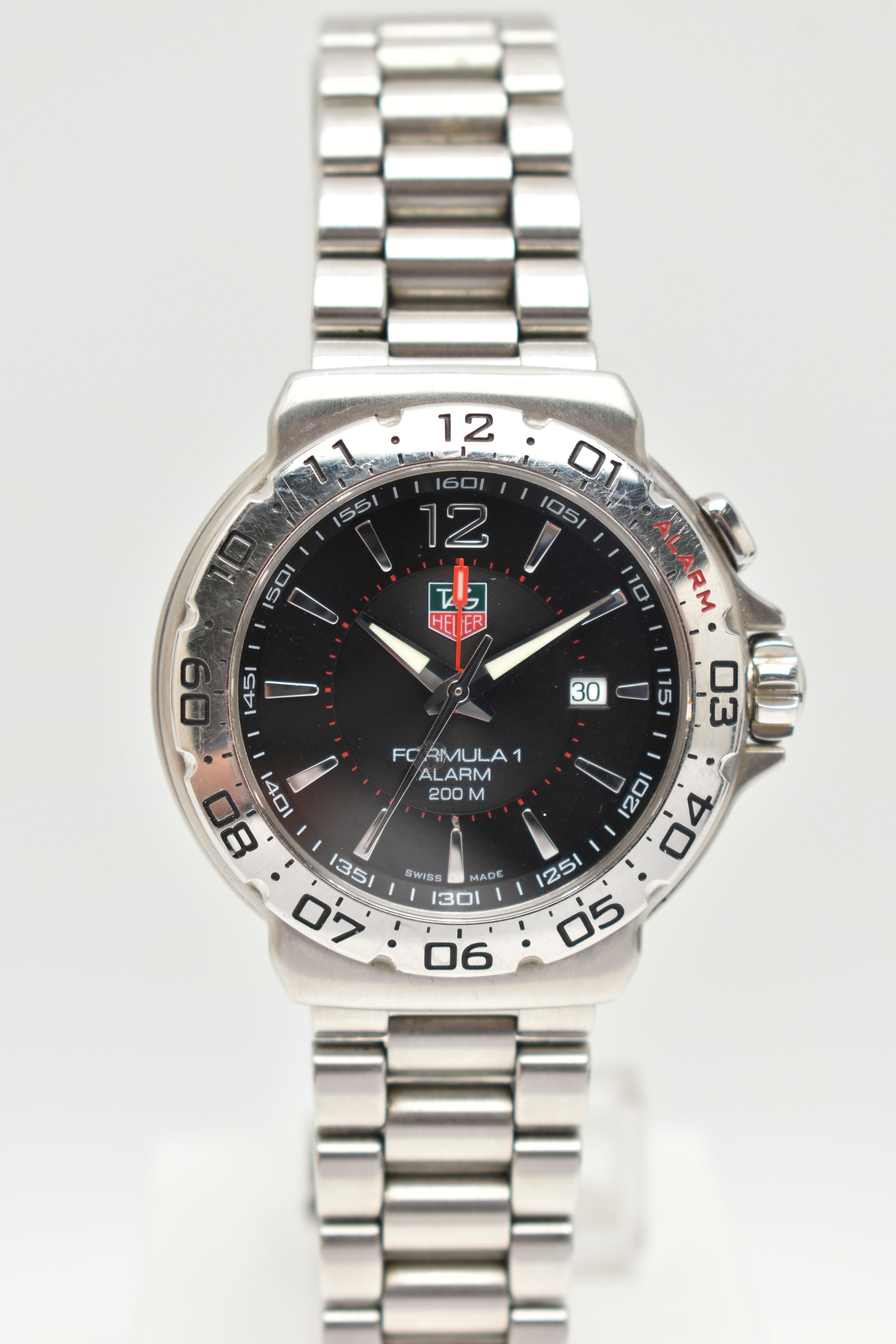 A 'TAG HEUER' FORMULA 1 WRISTWATCH, quartz movement, round black dial, signed 'Tag Heuer Formula 1