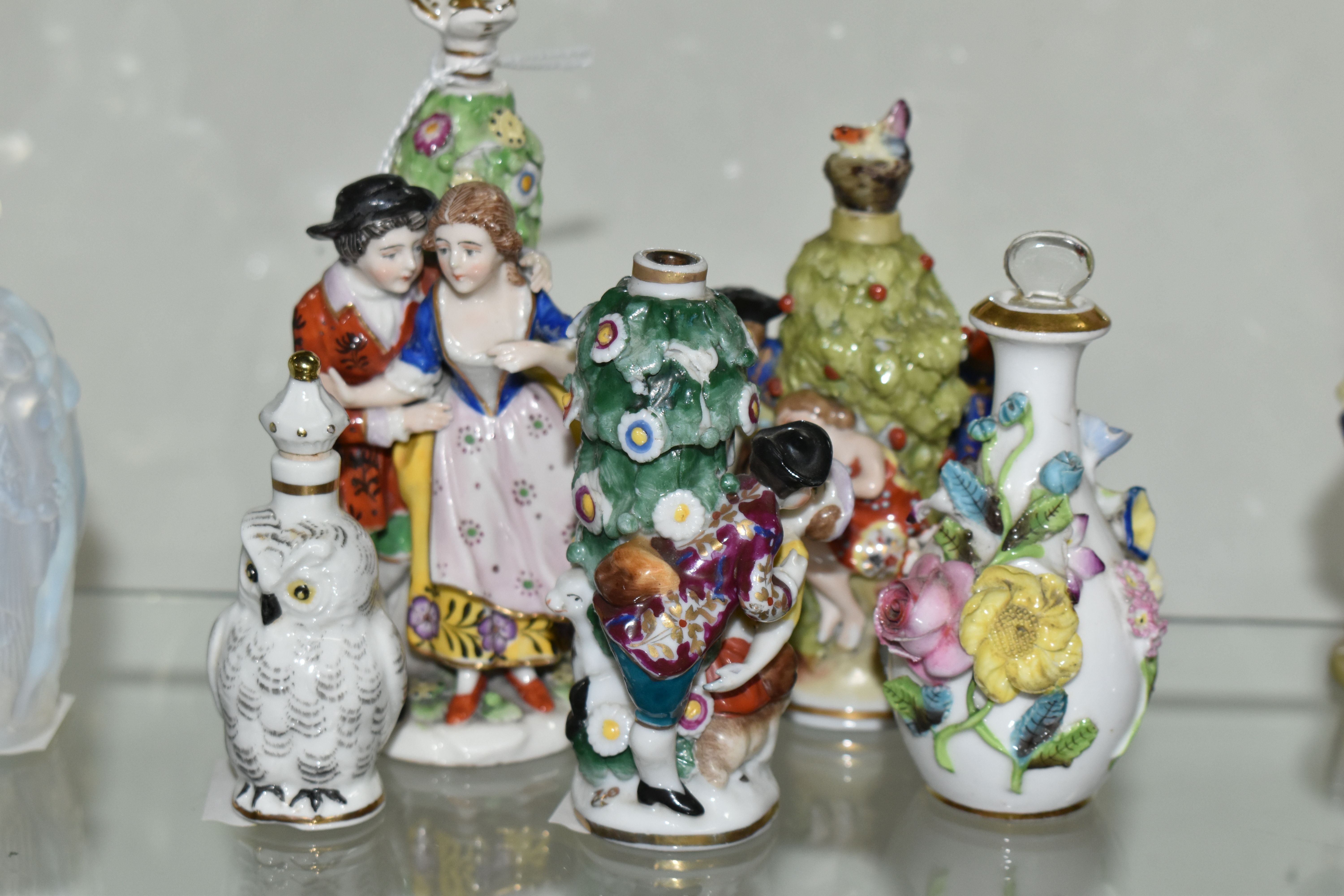 FIVE LATE 19TH AND 20TH CENTURY CONTINENTAL PORCELAIN SCENT BOTTLES, three of figural form with