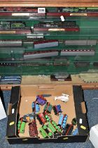 A WALL MOUNTED WOODEN GLASS FRONTED SHELVING UNIT CONTAINING MODEL RAILWAY ITEMS, to include unboxed