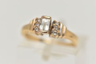 AN 18CT GOLD DIAMOND RING, a baguette cut diamond, half bezel set in yellow gold, approximate