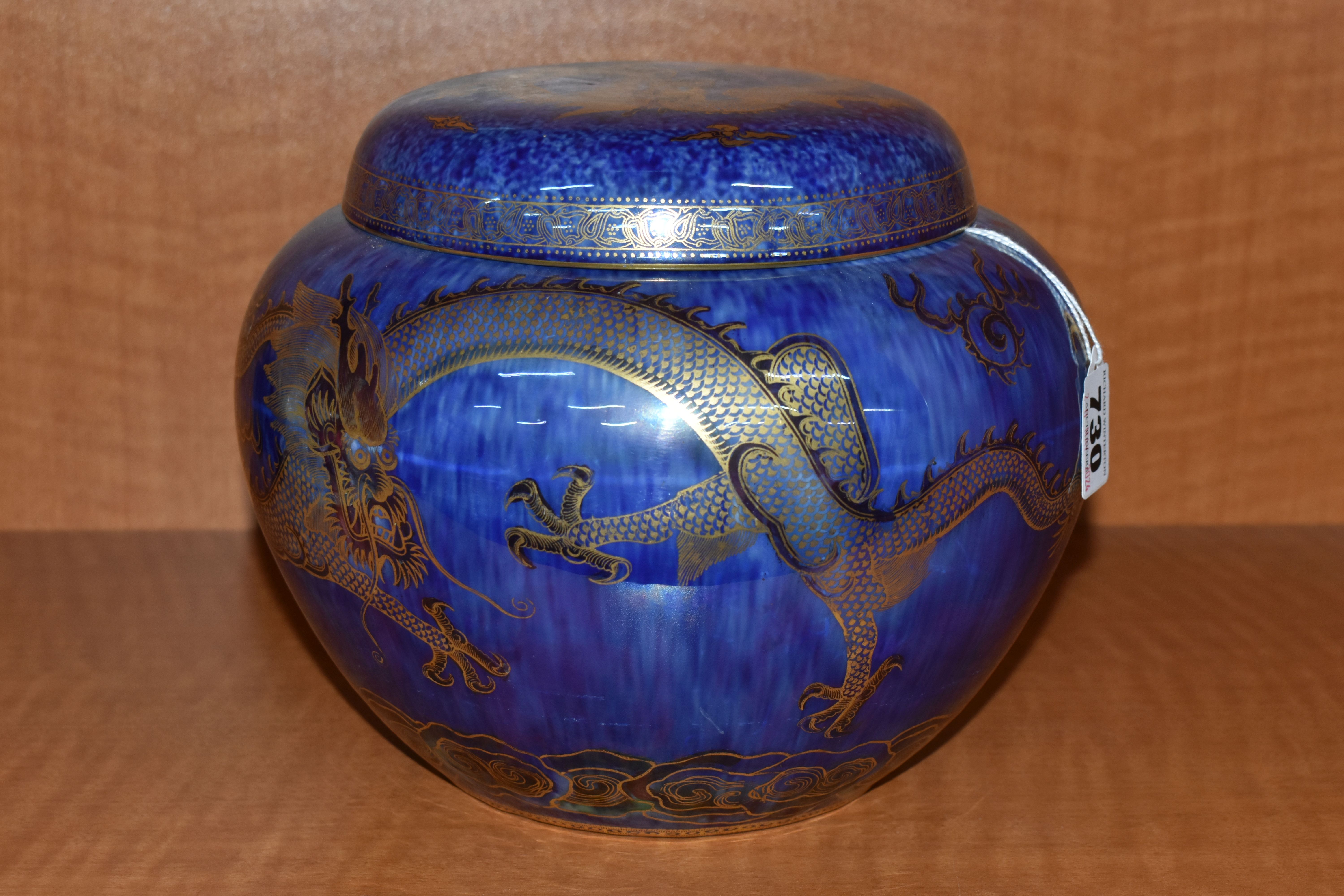 A WEDGWOOD DRAGON LUSTRE GINGER JAR AND COVER, pattern Z4829, the exterior with mottled blue