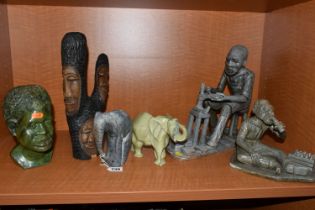 A COLLECTION OF SIX AFRICAN STONE AND TREEN FIGURAL CARVINGS, comprising two sculpted as men, one