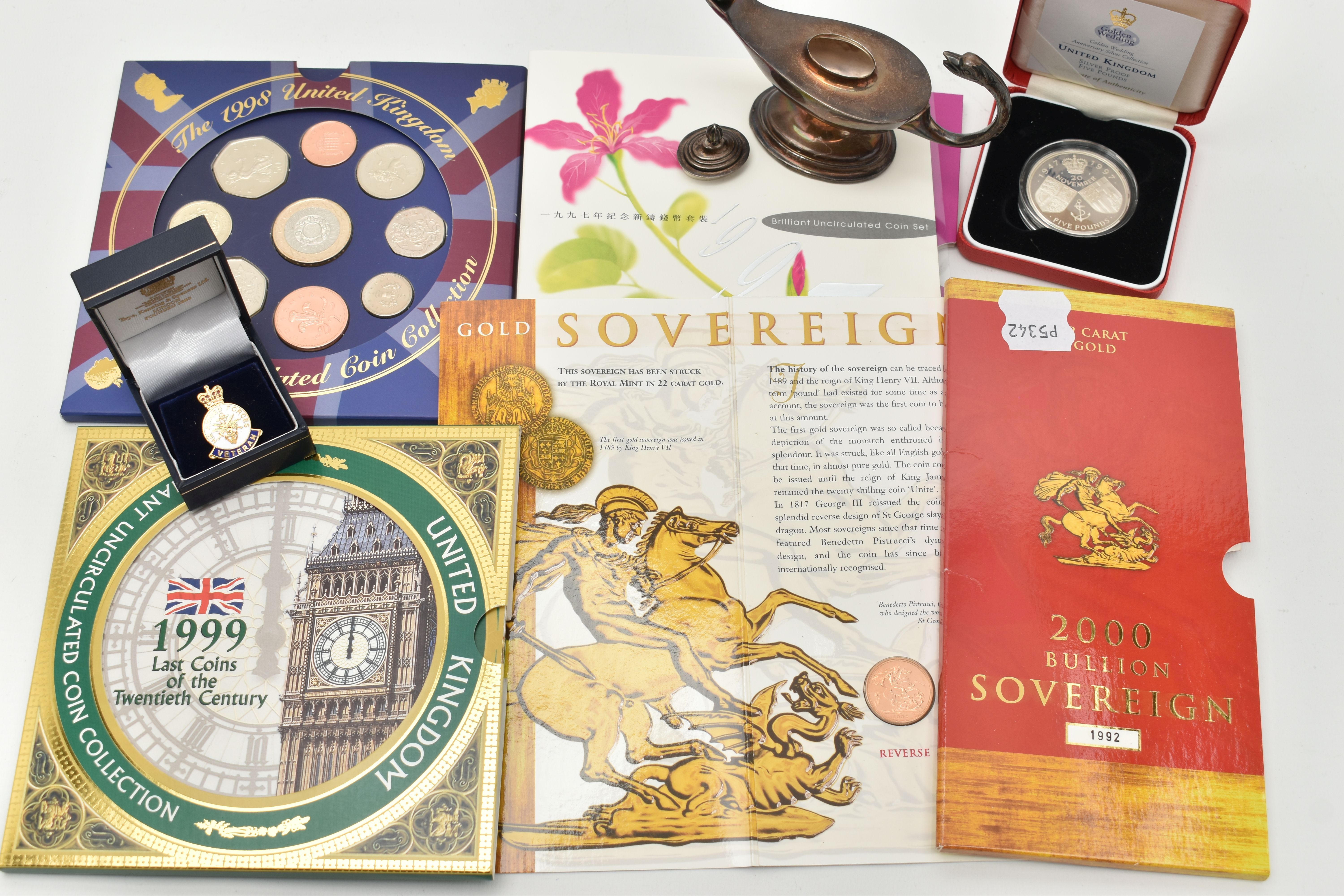 A CARDED BULLION FULL SOVEREIGN COIN AND A SMALL QUANTITY OF ITEMS, to include a carded full gold