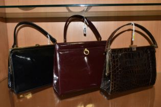 THREE LADIES' VINTAGE HANDBAGS, comprising a brown French faux Croc bag, a claret patent leather