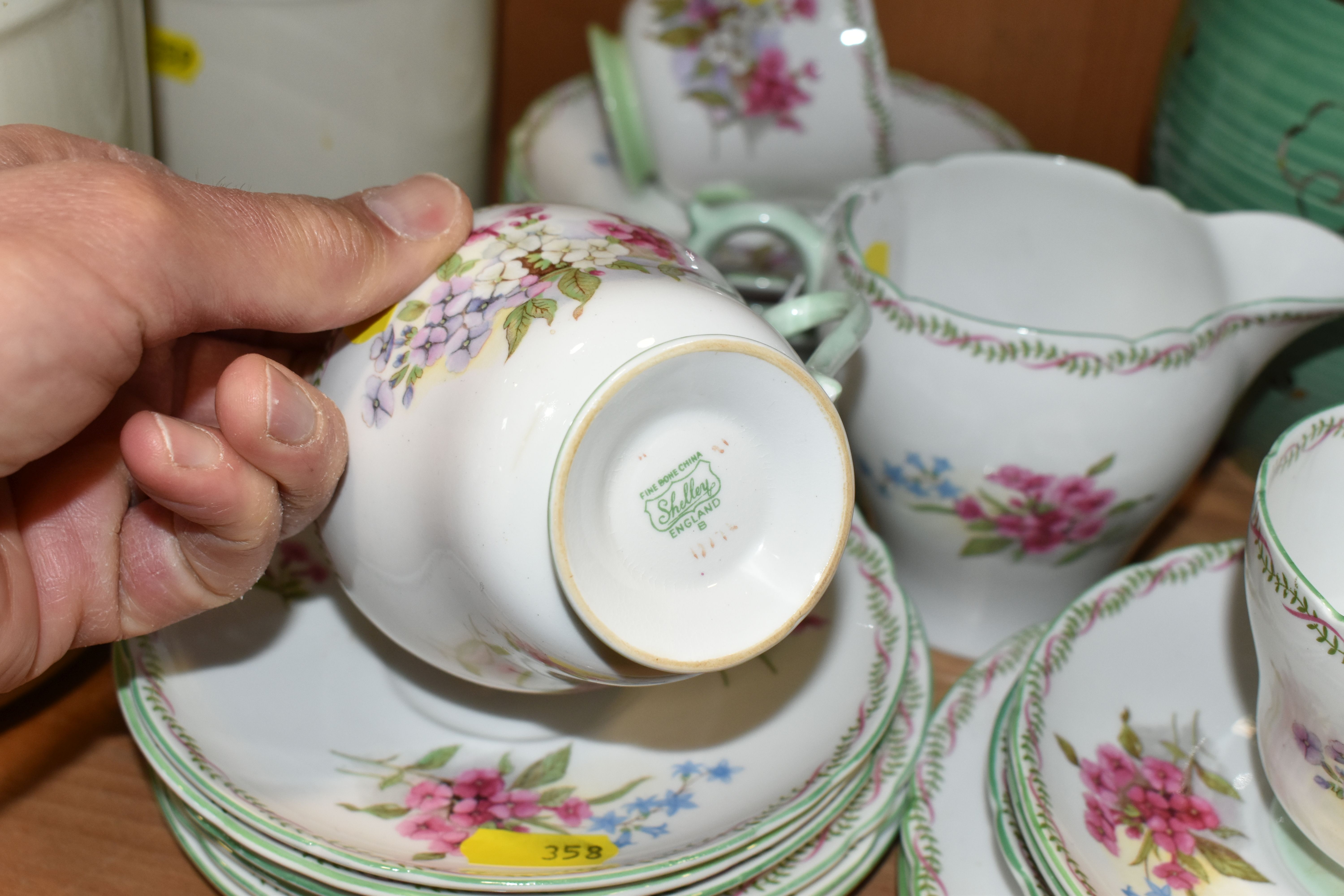 A GROUP OF WEDGWOOD TEAWARE, a Wedgwood tea set decorated with blue floral swags, gilt edged on a - Image 5 of 7