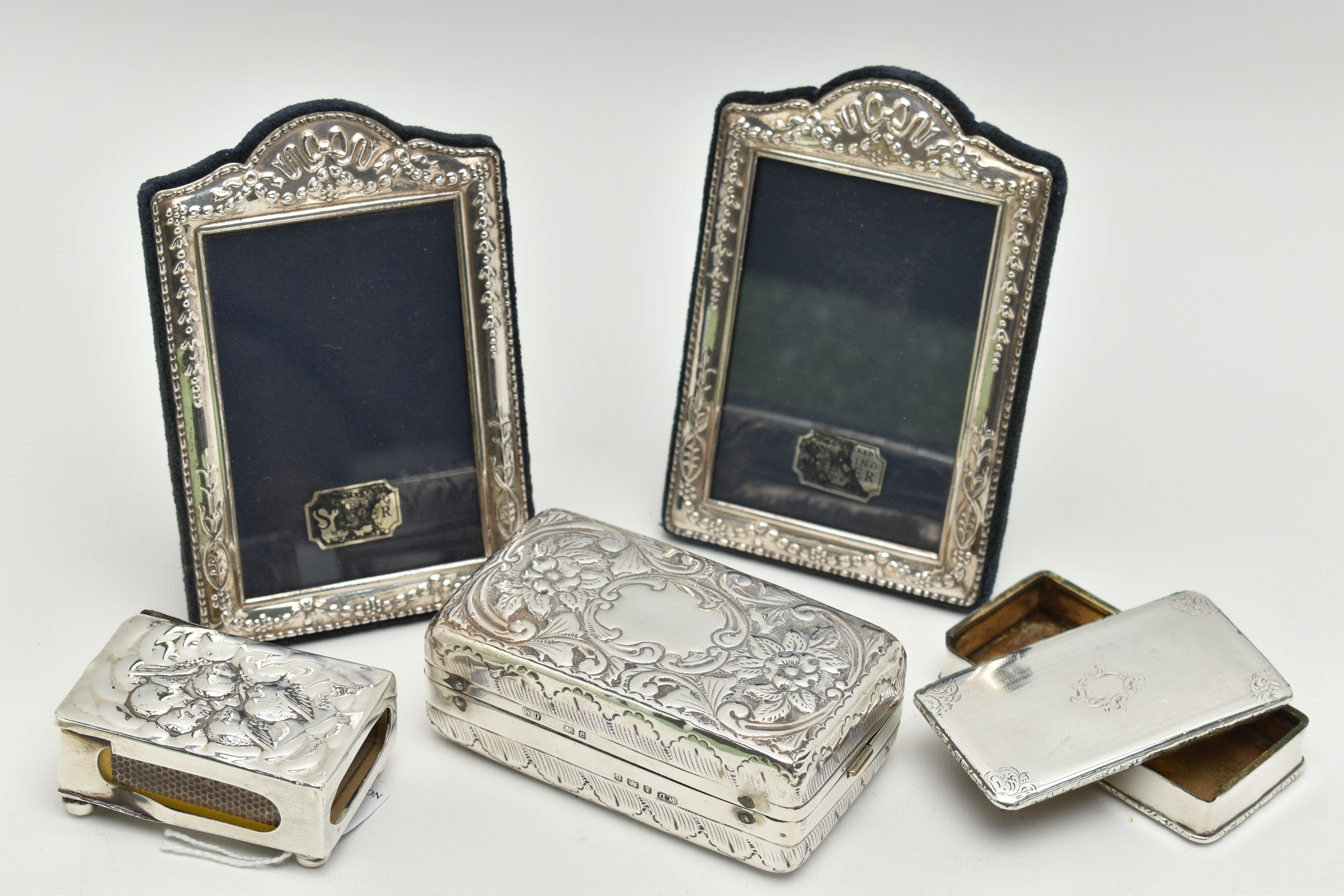 A SMALL PARCEL OF SILVER, a pair of Elizabeth II rectangular easel back photograph frames, foliate