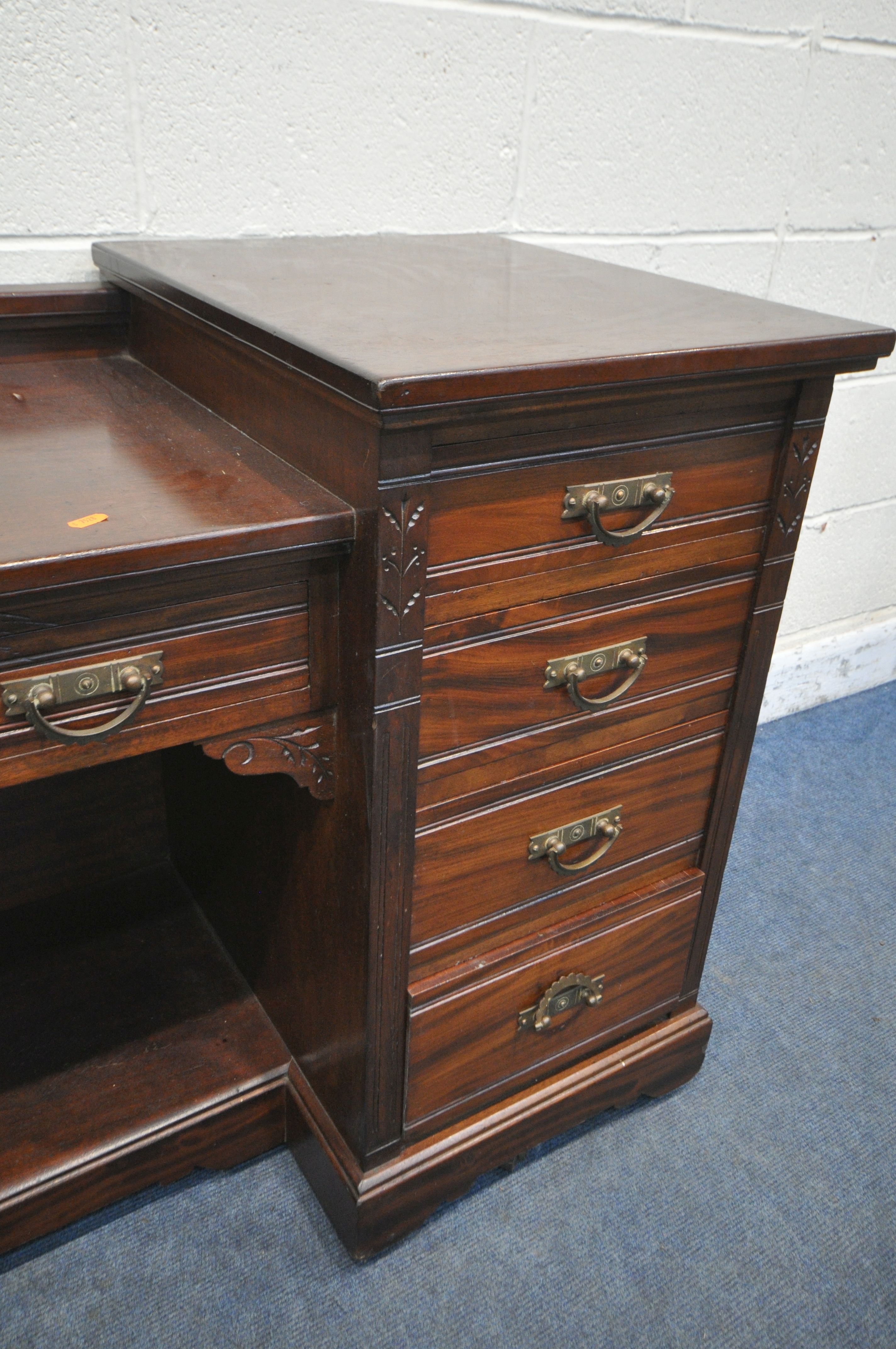 AN EDWARDIAN MAHOGANY DESK, fitted with nine drawers, on casters, width 152cm x depth 56cm x - Image 2 of 3