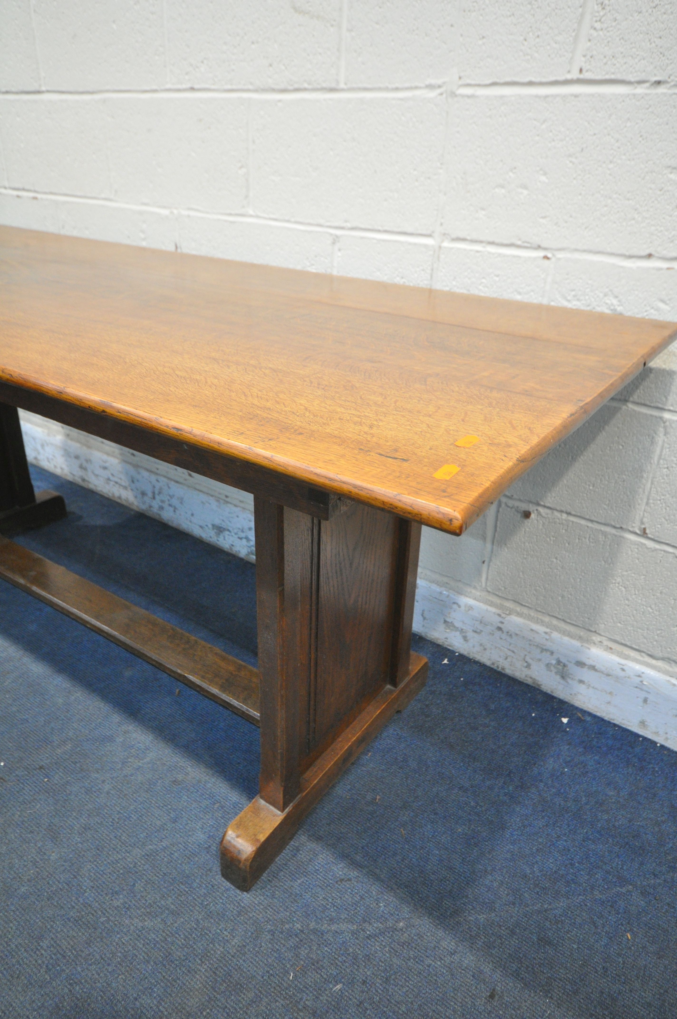 AN OAK TRESTLE DINING TABLE, united by a floor stretcher, length 182cm x 87cm x height 77cm ( - Image 2 of 3