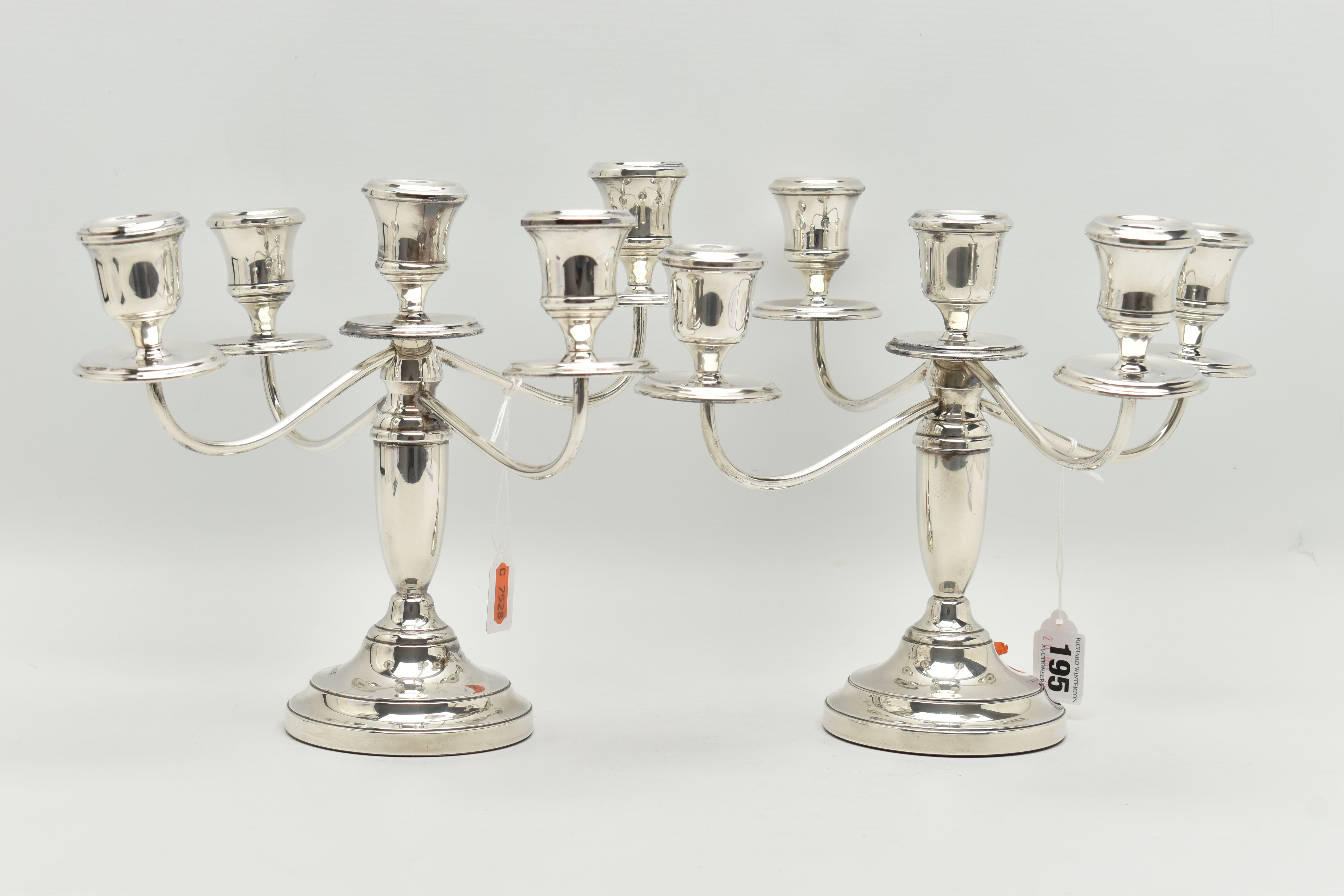 A PAIR OF ELIZABETH II SILVER FIVE LIGHT CANDELABRAS, baluster stems, stepped circular loaded