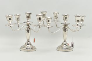 A PAIR OF ELIZABETH II SILVER FIVE LIGHT CANDELABRAS, baluster stems, stepped circular loaded