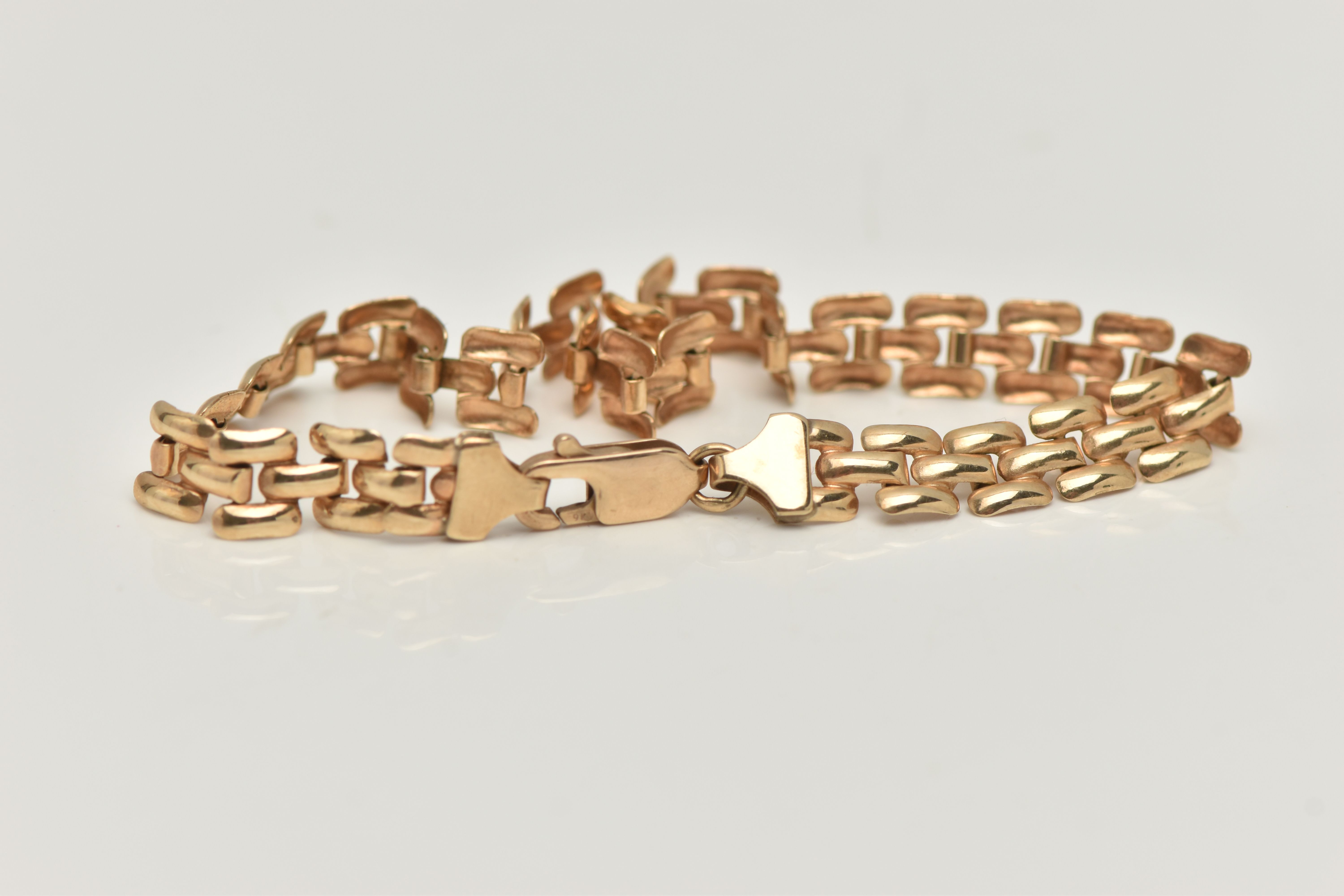 A 9CT GOLD ARTICULATED BRACELET, fitted with a lobster clasp, hallmarked 9ct Birmingham, length - Image 2 of 2