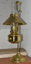 A MODERN BRASS OIL LAMP OF EARLY 20TH CENTURY STYLE, bears Pullman emblem to the reservoir, on an