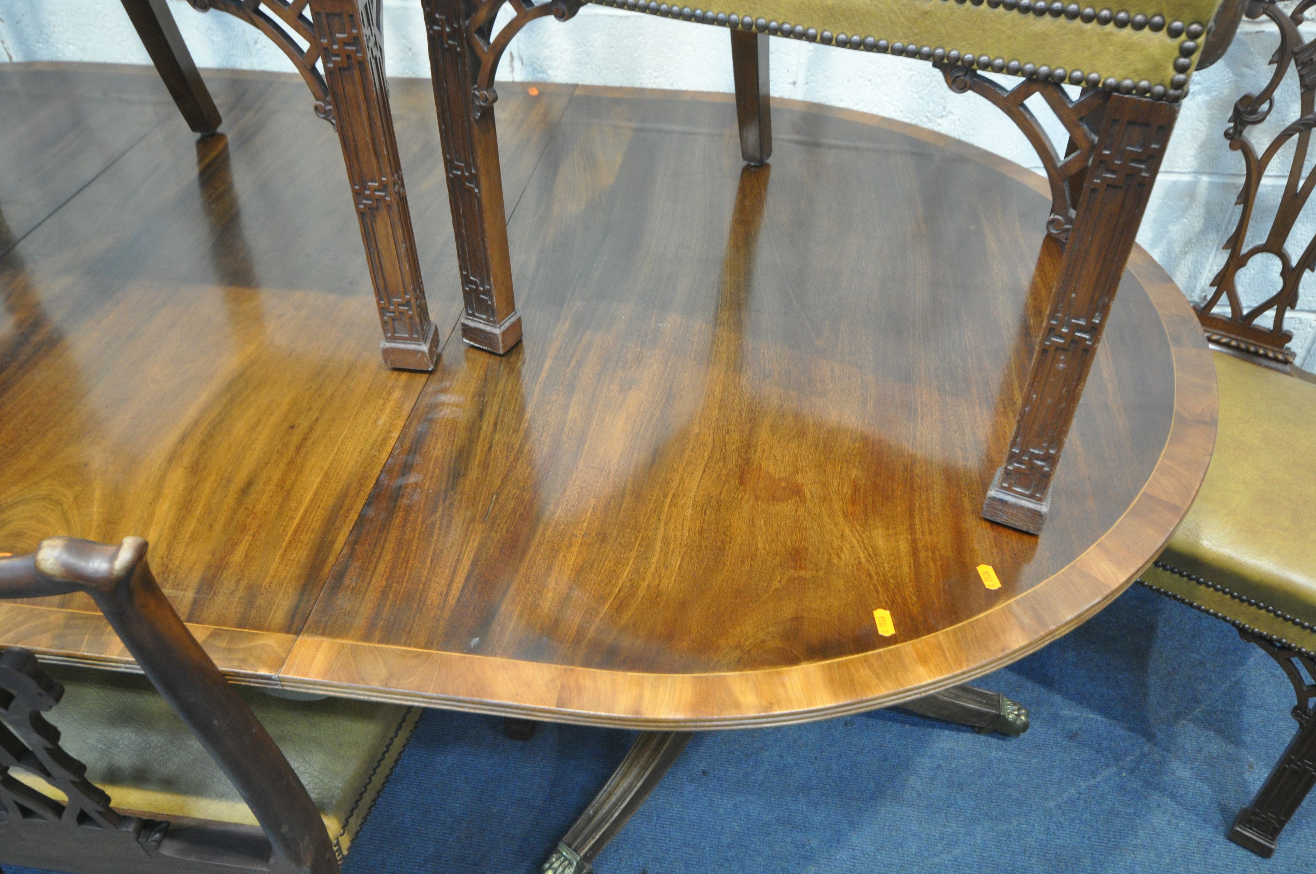 AN GEORGIAN STYLE MAHOGANY AND CROSSBANDED TWIN PEDESTAL DINING TABLE, with a single additional - Image 7 of 7