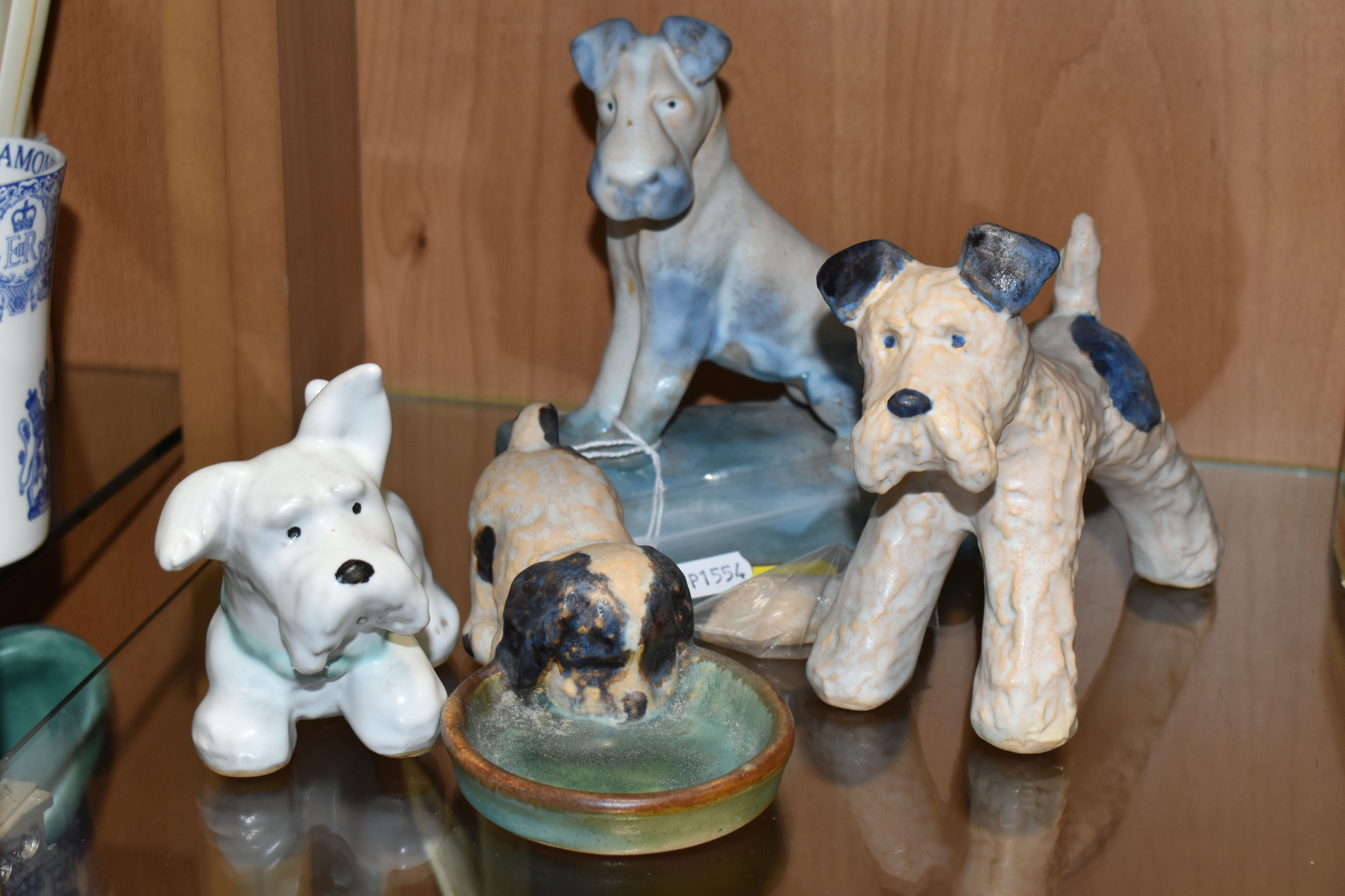FOUR BOURNE DENBY DOGS c1930, comprising a Danesby Ware bookend in the form of a terrier (broken