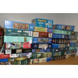 A COLLECTION OF MODERN BOXED JIGSAWS, to include examples by Ravensburger, Jumbo (including Wasgij),