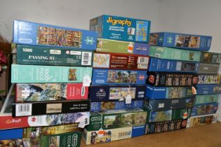 A COLLECTION OF MODERN BOXED JIGSAWS, to include examples by Ravensburger, Jumbo (including Wasgij),