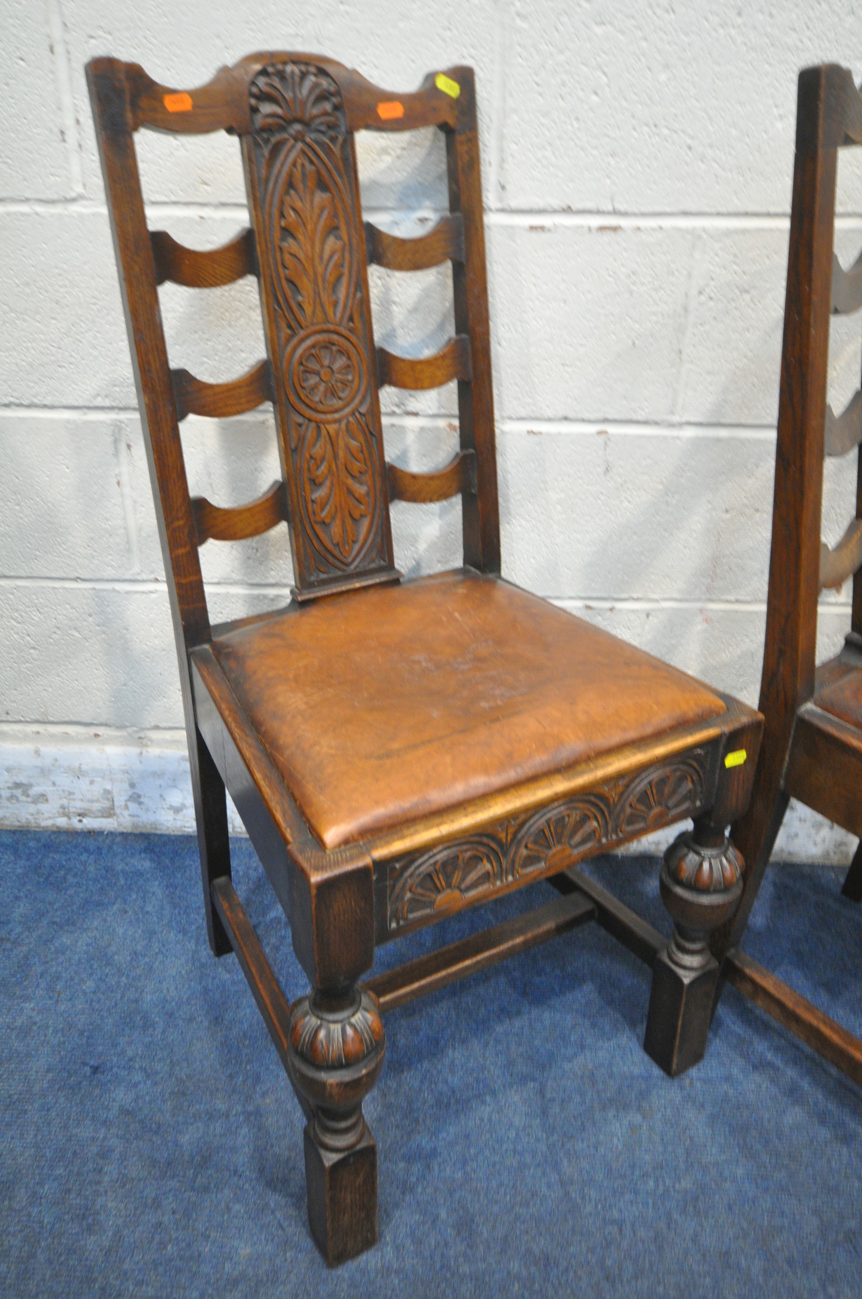 A SET OF EARLY 20TH CENTURY OAK DINING CHAIRS, with foliate backrests, brown leather seat pads, - Image 3 of 4