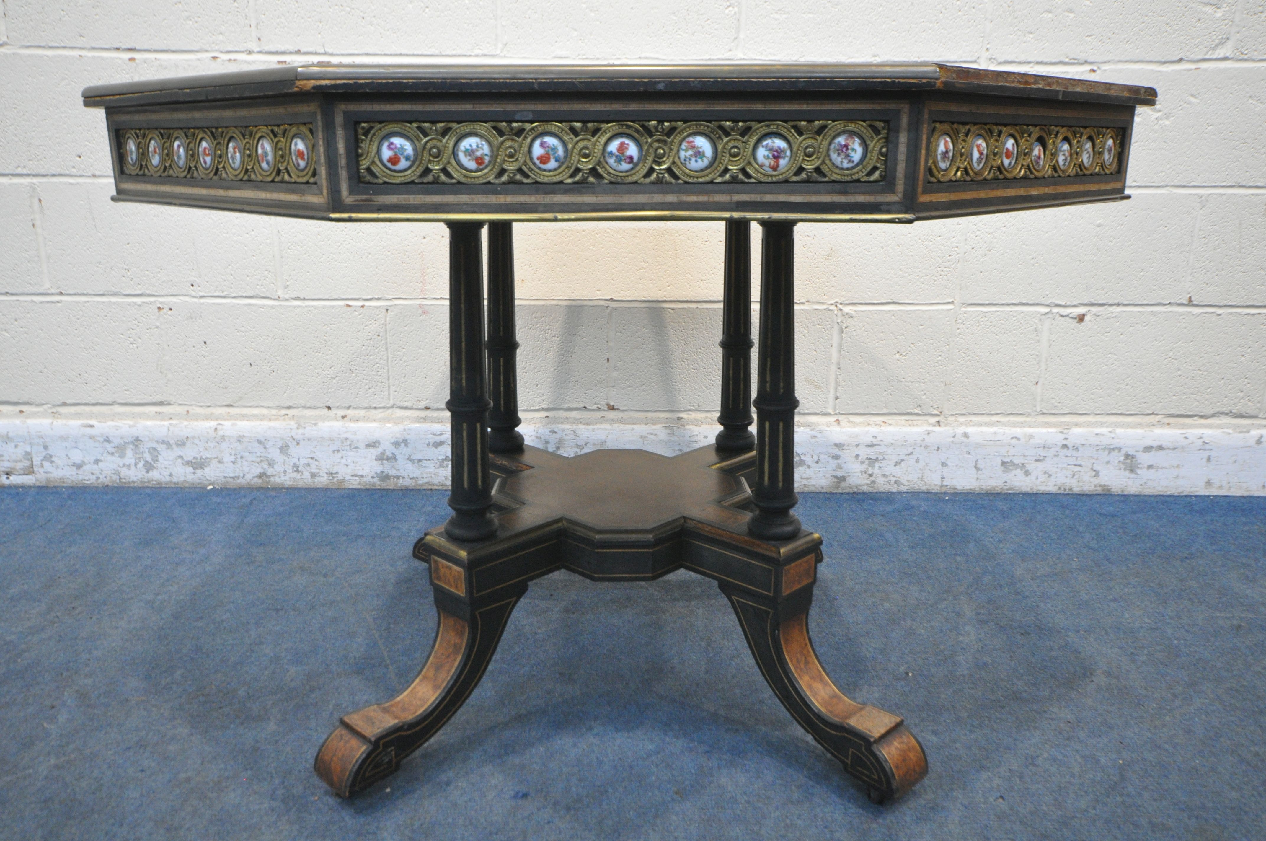 A MID TO LATE 19TH CENTURY EBONISED AND AMBOYNA OCTAGONAL CENTRE TABLE, with brass and porcelain - Image 2 of 6