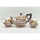 AN EDWARD VII THREE PIECE SILVER TEA SET, comprising of a Queen Anne style tea pot, milk jug and