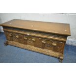 A CARVED OAK BLANKET CHEST, with iron drop handles, width 123cm x depth 49cm x height 47cm (