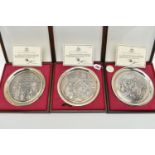 THREE ELIZABETH II SILVER BIRMINGHAM MINT LIMITED EDITION CHRISTMAS PLATES, 1975-1977, repoussé