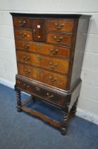 A WILLIAM AND MARY STYLE WALNUT AND BOX STRUNG CHEST ON STAND, fitted with an arrangement of eight