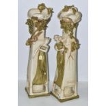 A PAIR OF ROYAL DUX ART NOUVEAU FIGURAL VASES, each modelled with a scrolling neck with fruiting