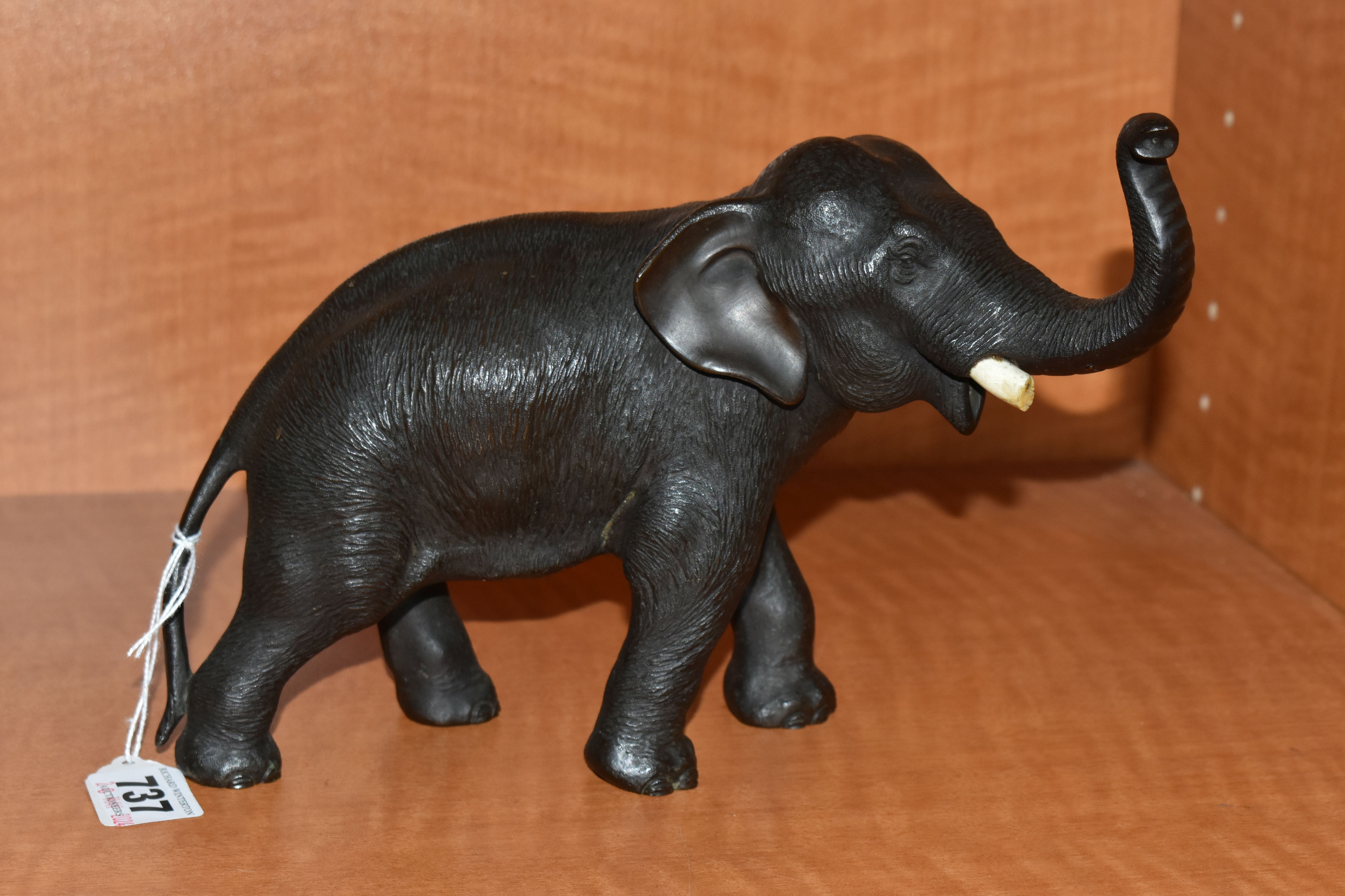 A LATE 19TH CENTURY MEIJI PERIOD JAPANESE BRONZE FIGURE OF AN ELEPHANT WITH TRUNK RAISED, remnants