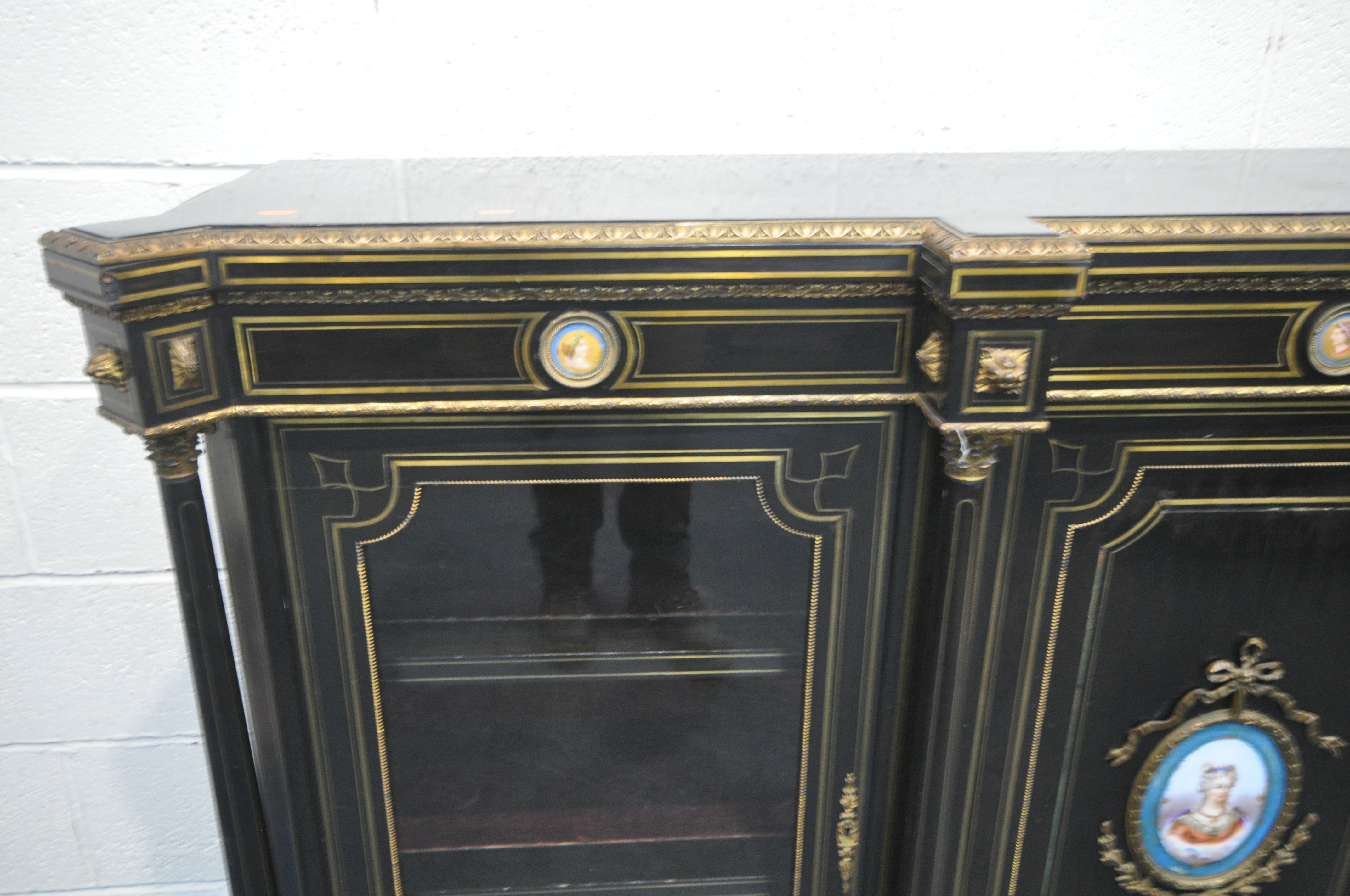 A 19TH CENTURY EBONISED AND GILT BRASS CREDENZA, with four moulded tops supporting Corinthian - Image 3 of 7