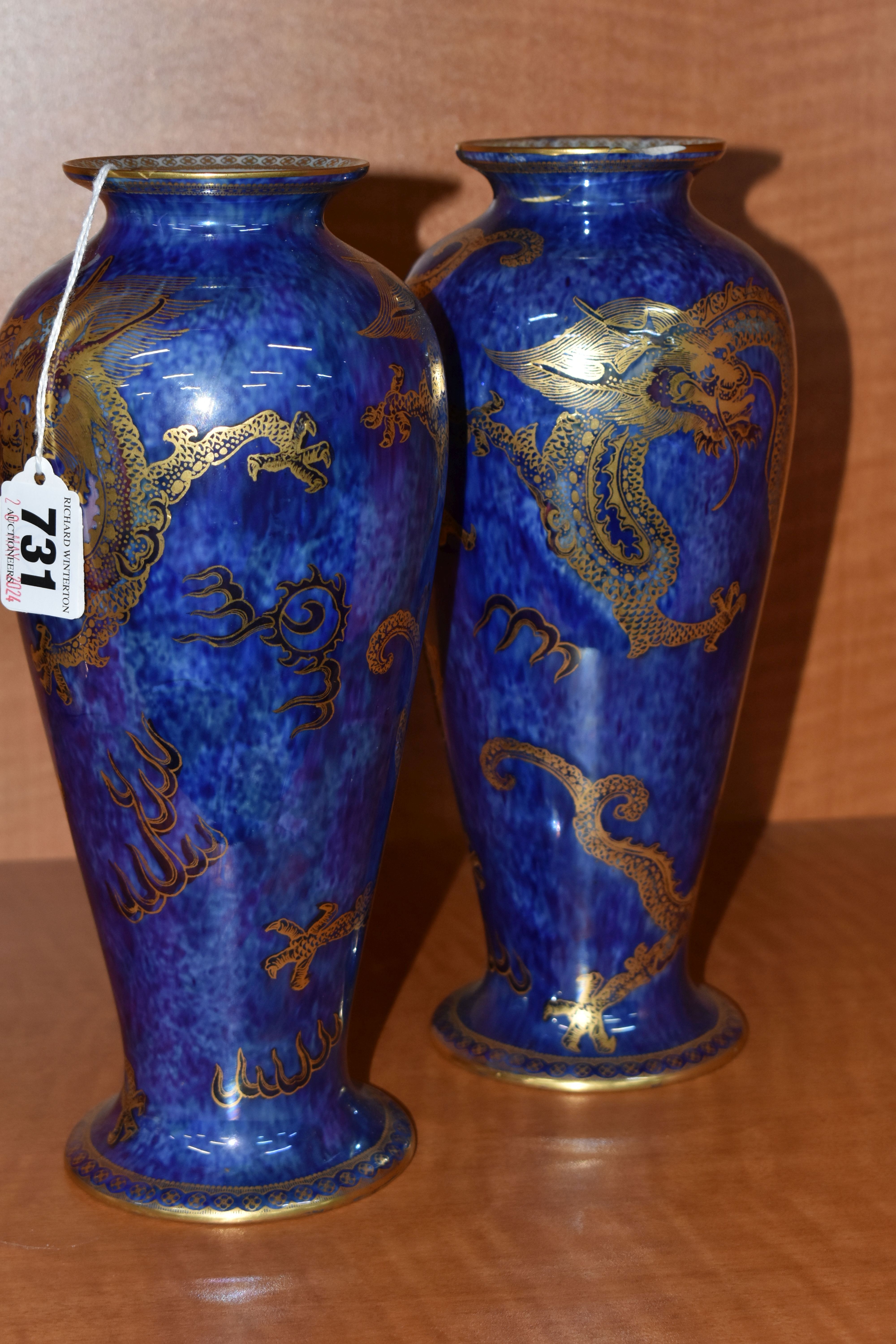 A PAIR OF WEDGWOOD DRAGON LUSTRE BALUSTER VASES, pattern Z4829, the exterior with mottled blue