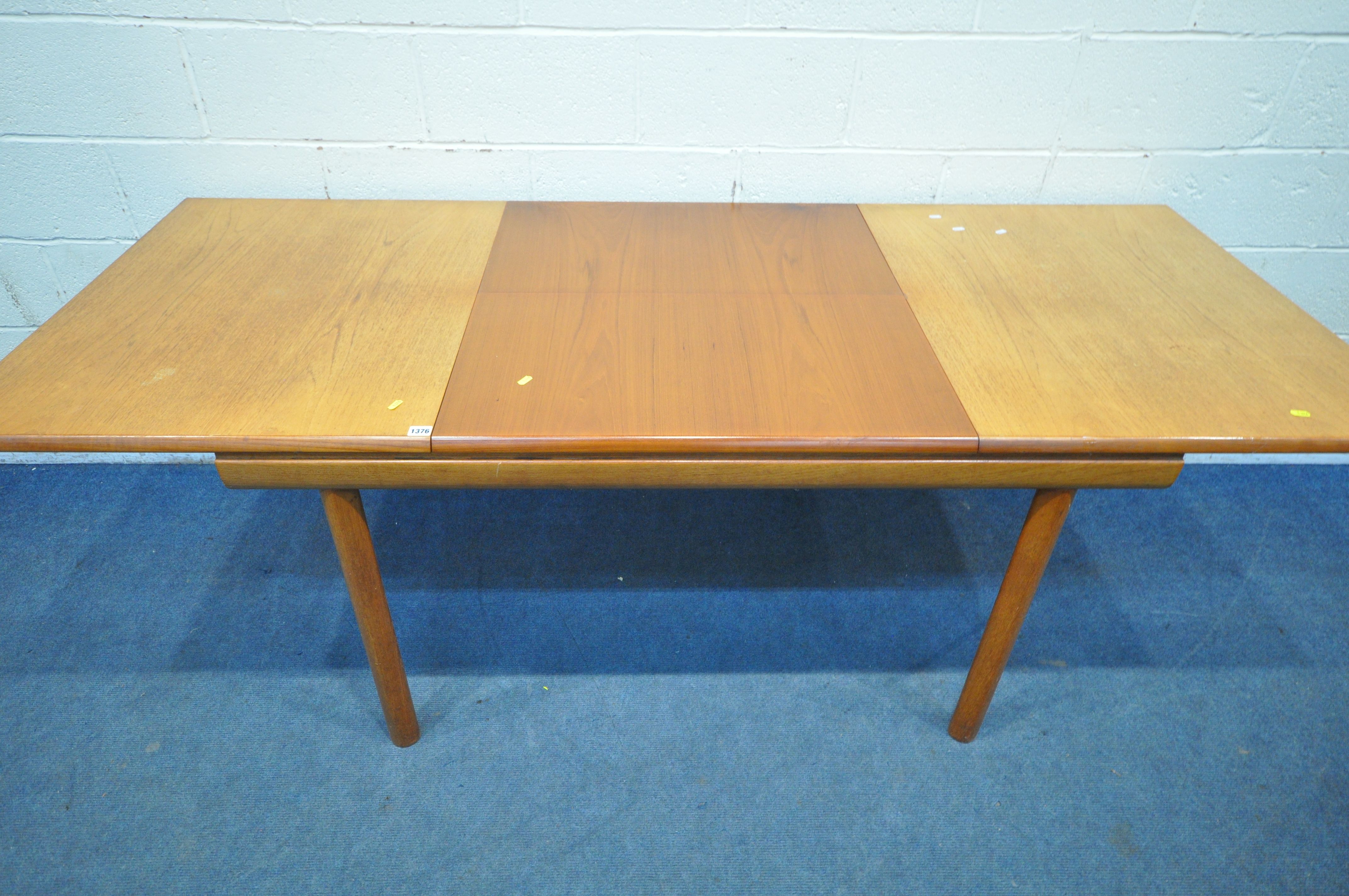 WHITE AND NEWTON LTD, A MID CENTURY TEAK EXTENDING DINING TABLE, with a single fold out leaf, - Image 6 of 9