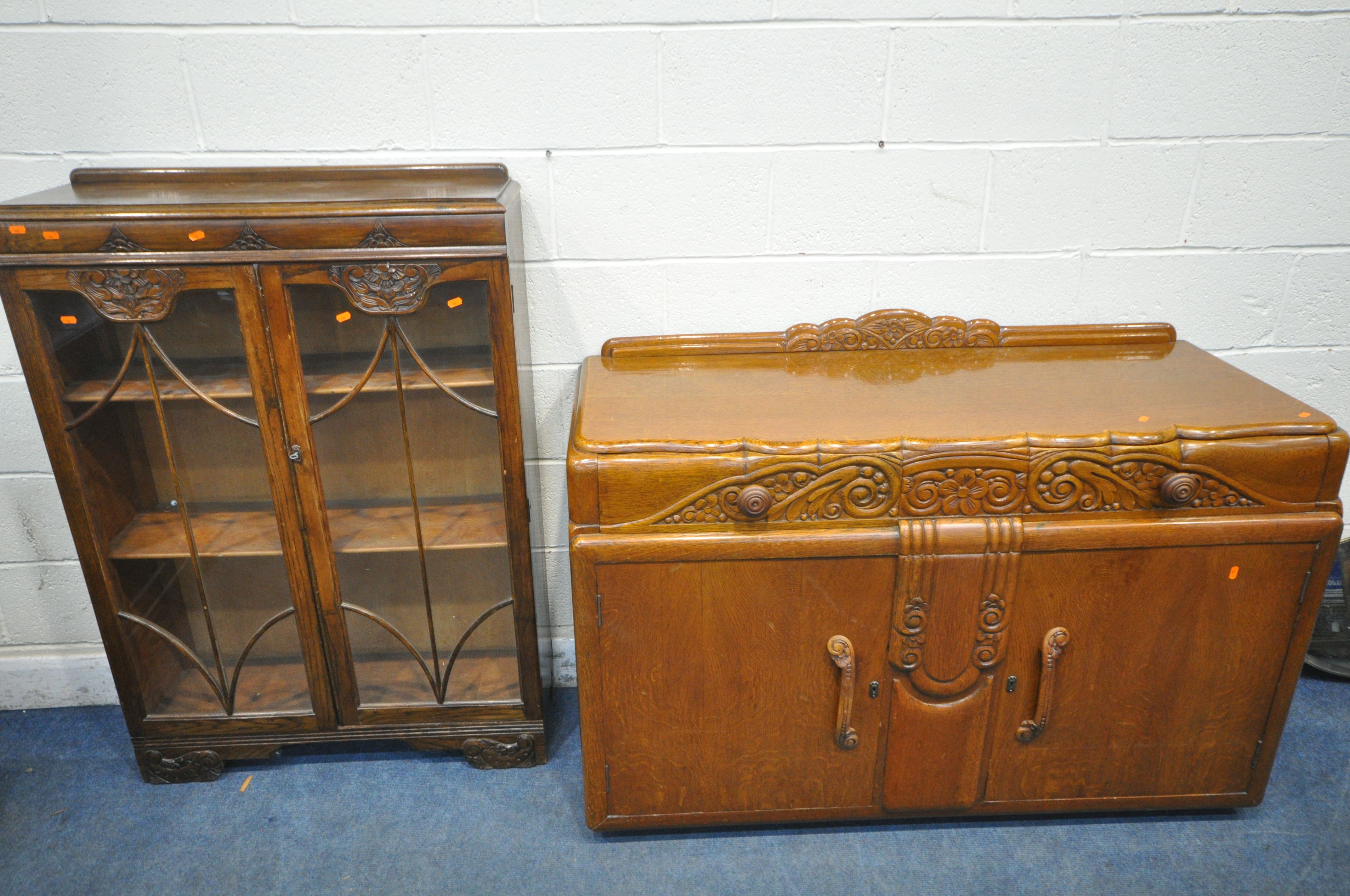 A 1940'S OAK SIDEBOARD, with two drawers and cupboard doors, width 137cm x depth 55cm x height 96cm,