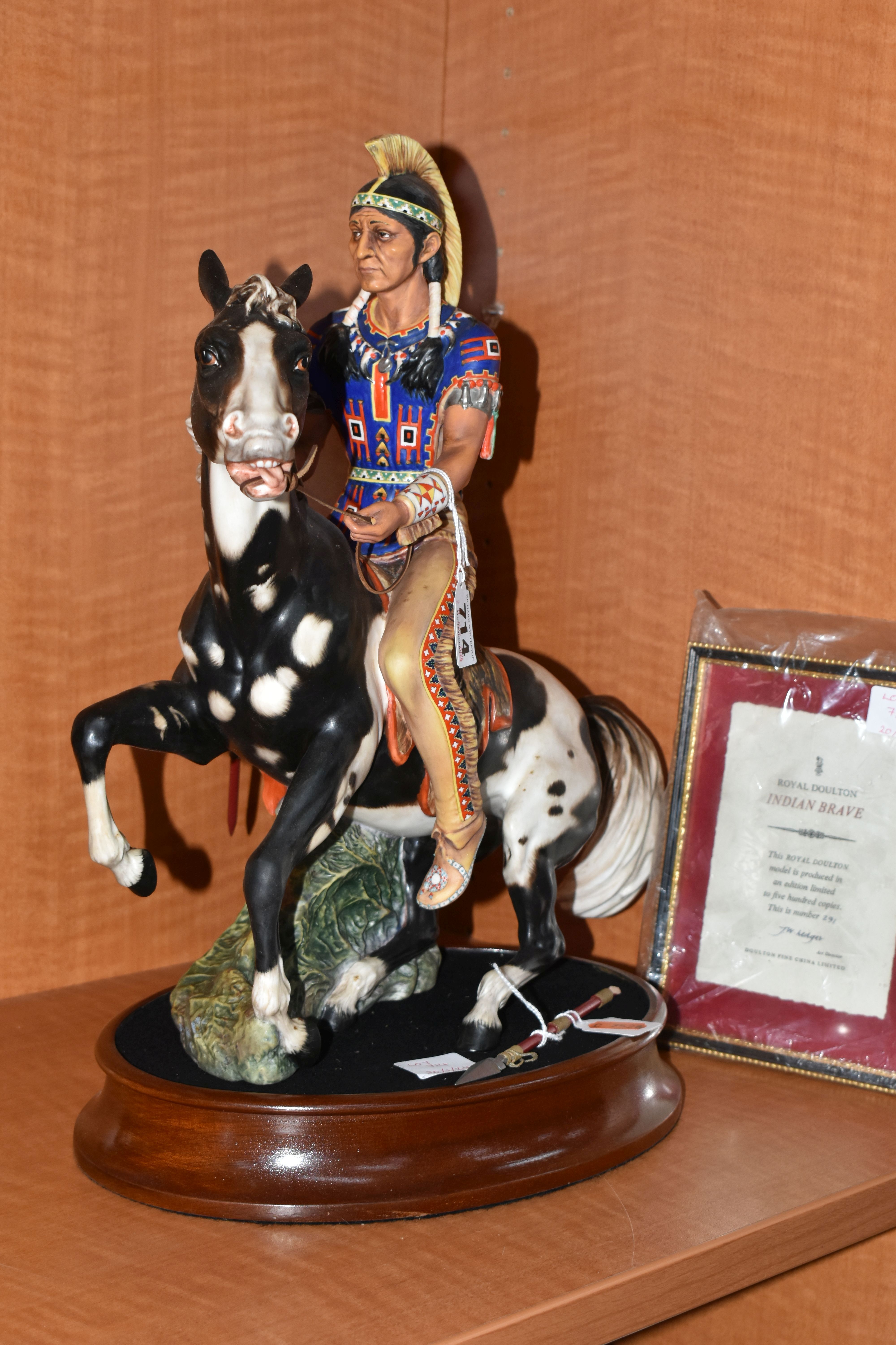 A ROYAL DOULTON LIMITED EDITION EQUESTRIAN FIGURE 'INDIAN BRAVE', HN2376, no.291/500, with a