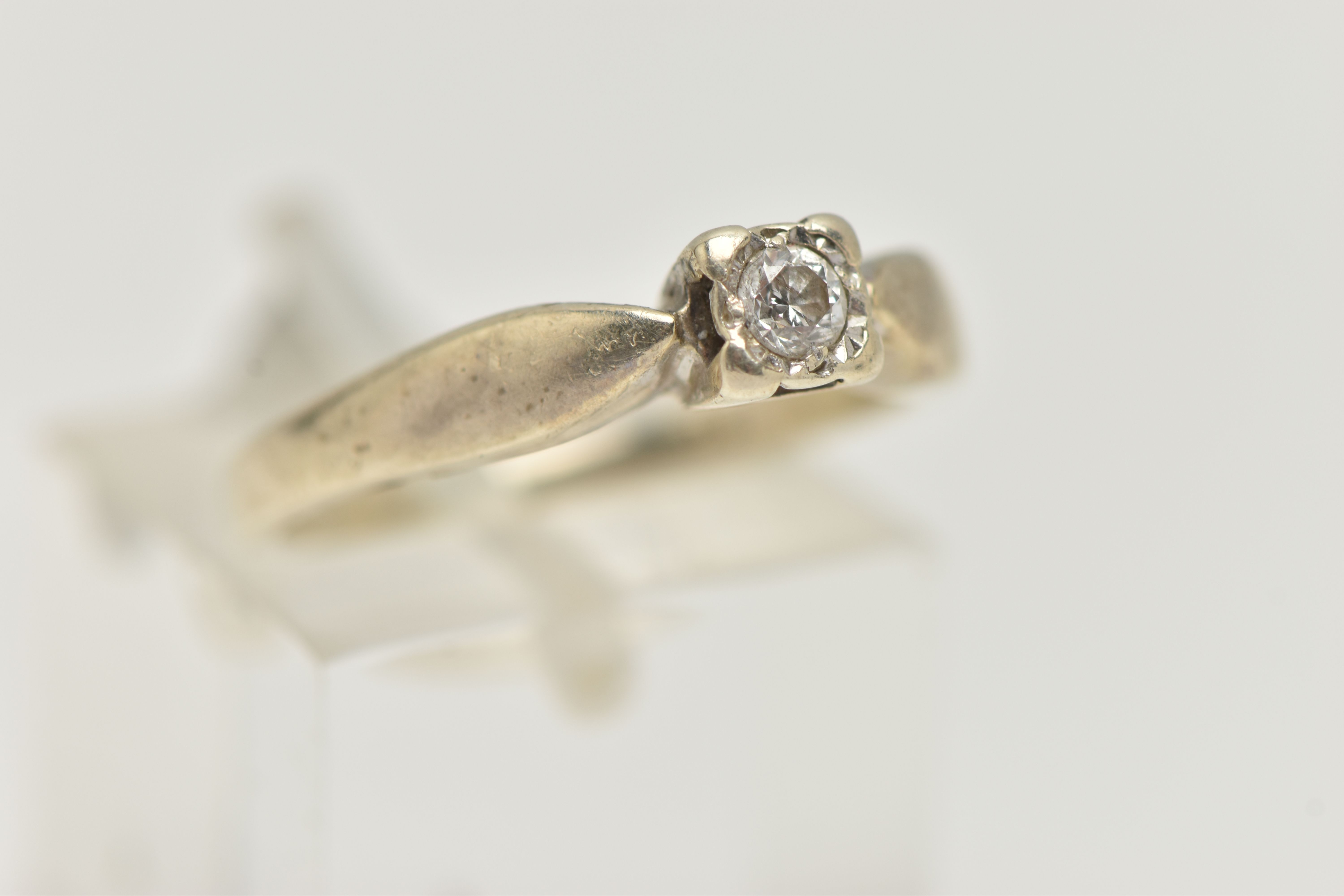 A 9CT GOLD SINGLE STONE DIAMOND RING, designed as a brilliant cut diamond within a square illusion - Image 4 of 4