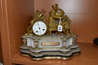 A LATE 19TH CENTURY GILT METAL AND ALABASTER MANTEL CLOCK, modelled as an artist seated beside the