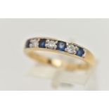 AN 18CT GOLD SAPPHIRE AND DIAMOND SEVEN STONE RING, designed as a line of four circular sapphires