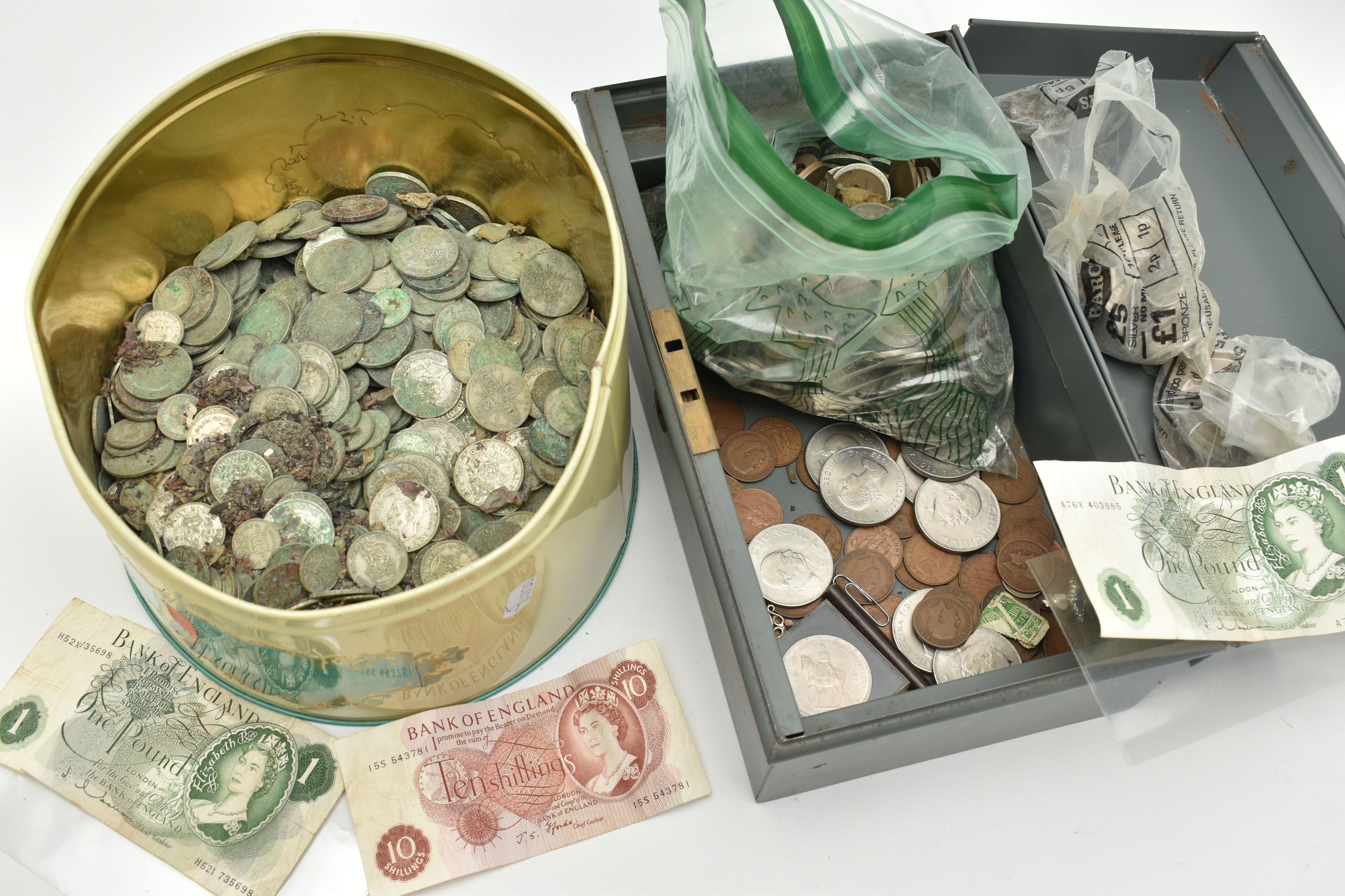 A METAL CASHBOX AND TIN CONTAINING MIXED COINS MANY WITH WATER DAMAGE, to include large amounts
