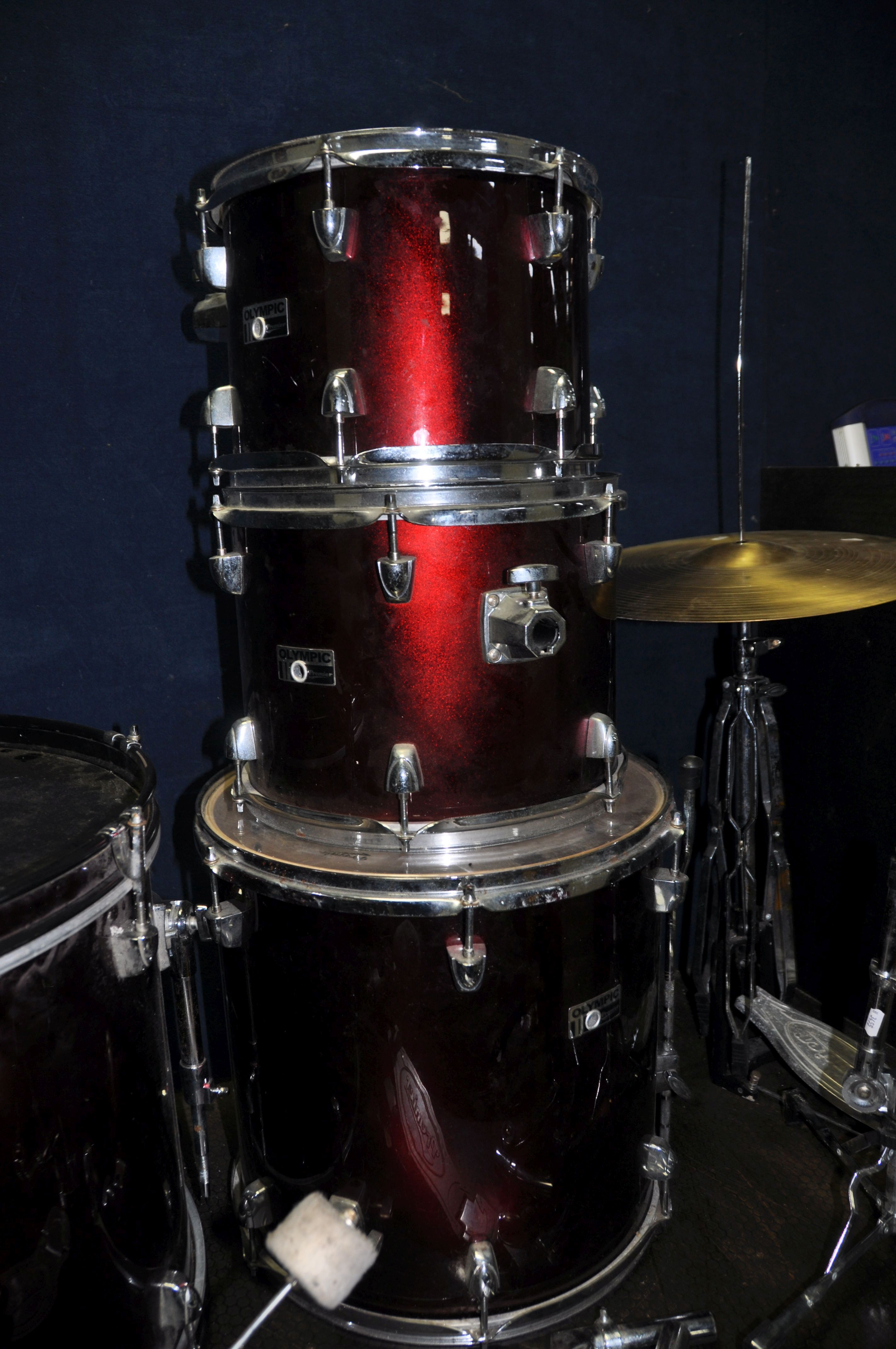 AN OLYMPIC BY PREMIER FOUR PIECE DRUM KIT in metallic red finish comprising of a 22in x 16in Kick - Image 4 of 6