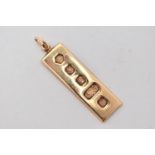 A 9CT GOLD INGOT PENDANT, a rectangular form pendant with decorative hallmarks, approximate length