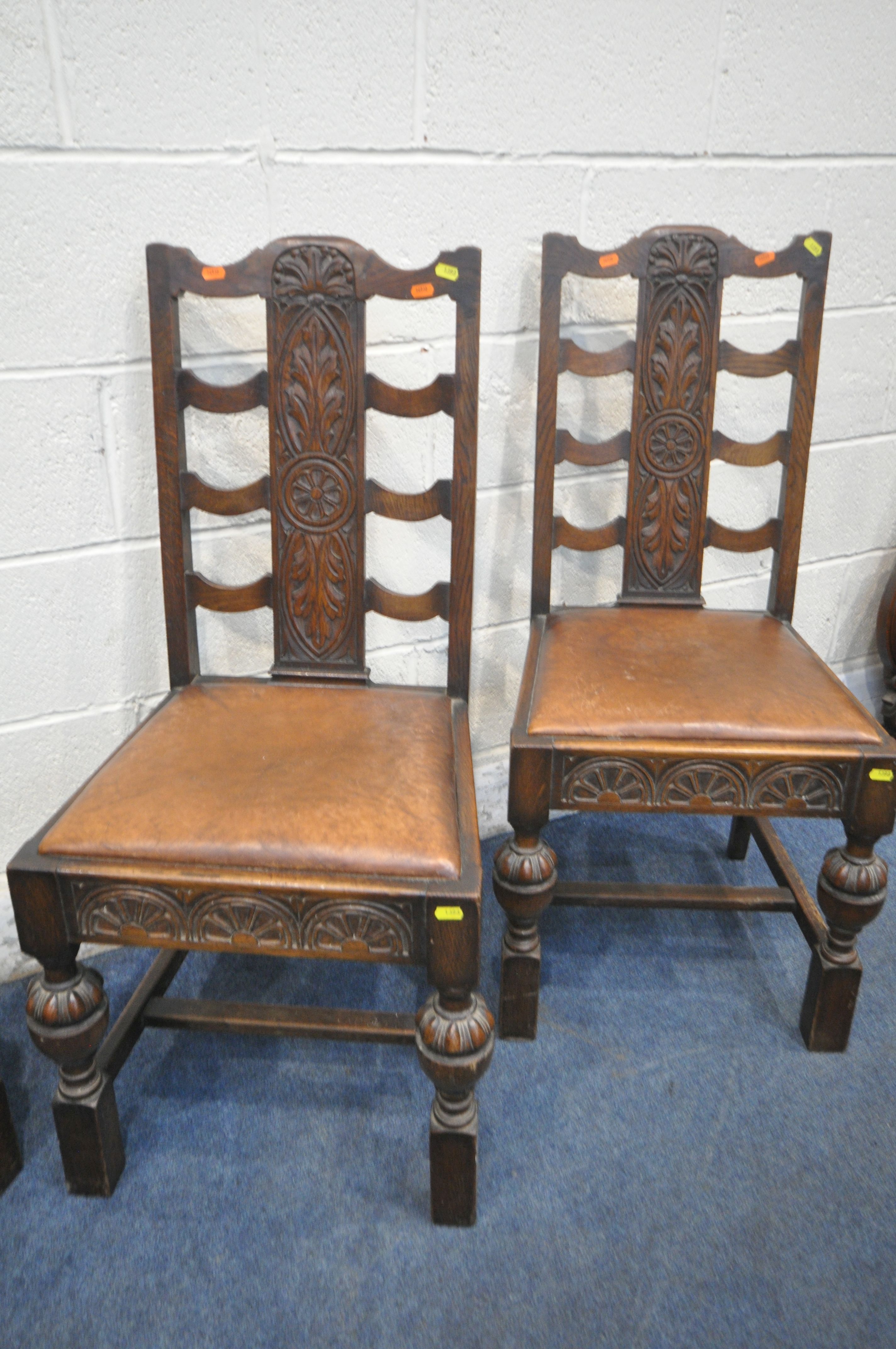 A SET OF EARLY 20TH CENTURY OAK DINING CHAIRS, with foliate backrests, brown leather seat pads, - Image 4 of 4