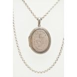 A LOCKET AND A CHAIN, a base metal oval locket with embossed floral and acanthus detail, together
