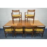 WHITE AND NEWTON LTD, A MID CENTURY TEAK EXTENDING DINING TABLE, with a single fold out leaf,
