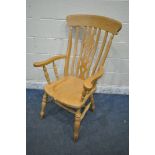 A MODERN BEECH WINDSOR ARMCHAIR (condition report: few water stains)