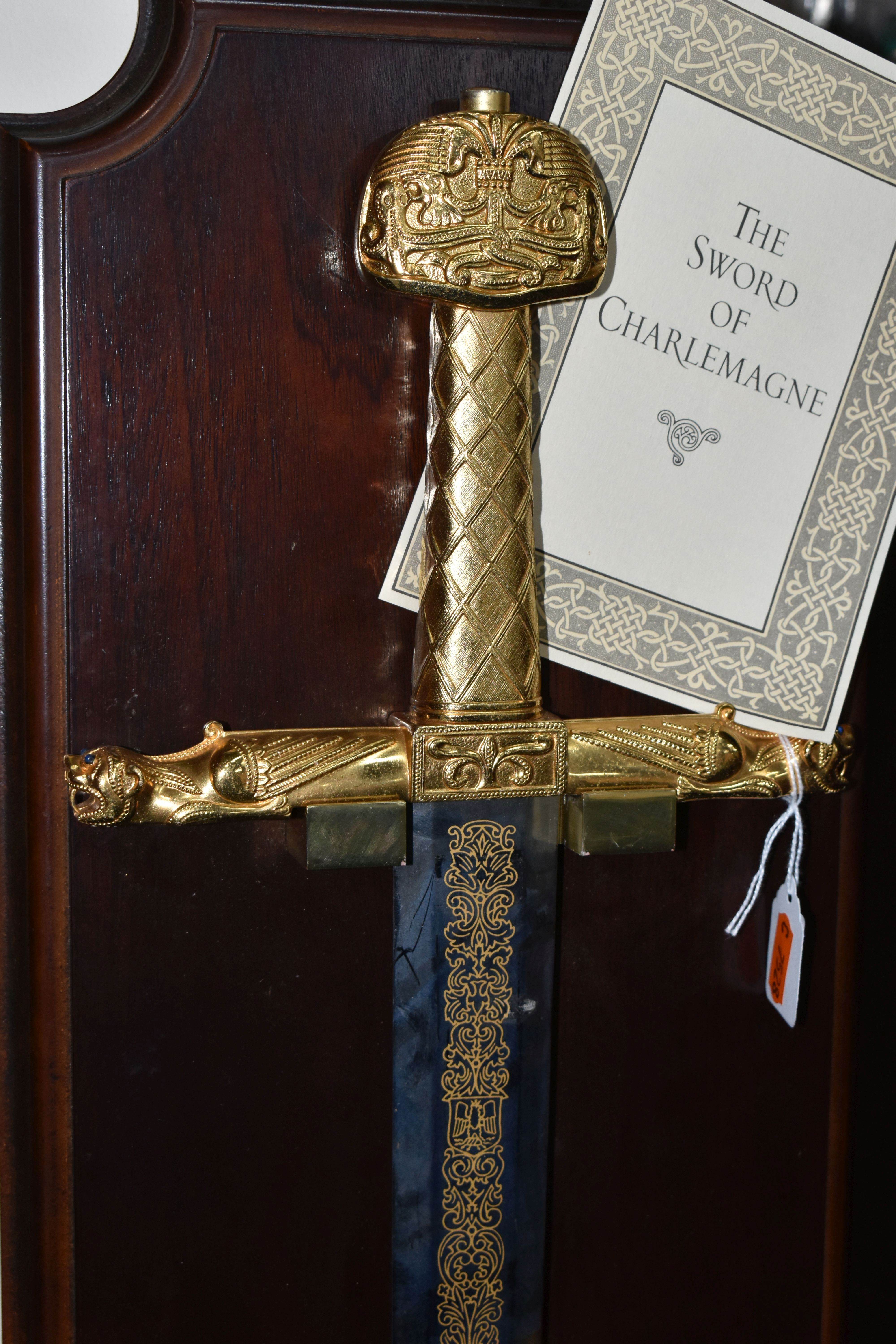 A REPRODUCTION FRANKLIN MINT SWORD OF CHARLEMAGNE WITH WOODEN DISPLAY BOARD AND CERTIFICATE, gold - Image 2 of 6