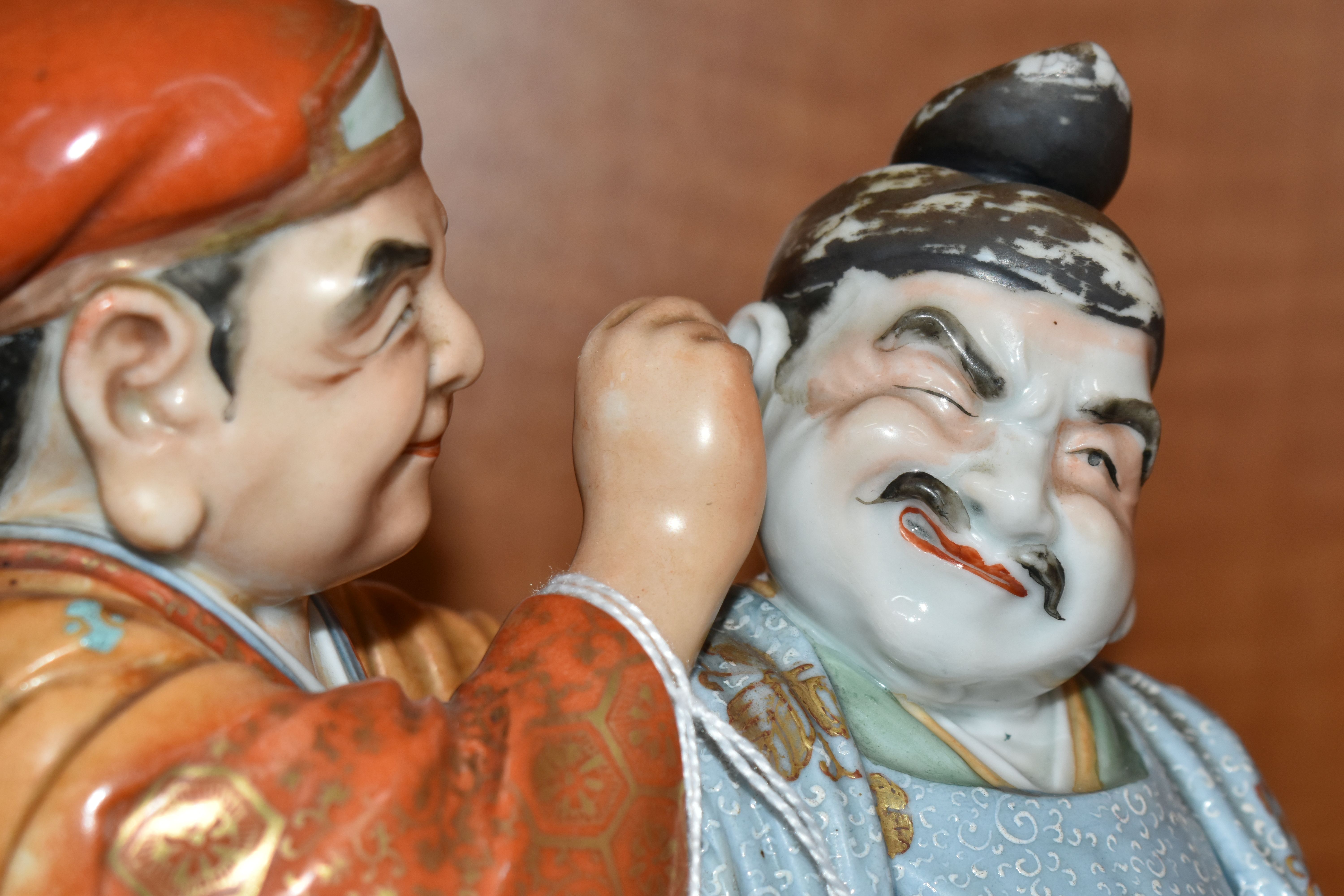 A LATE 19TH / EARLY 20TH CENTURY JAPANESE PORCELAIN FIGURE GROUP OF TWO MEN, one holding a carp - Image 7 of 9