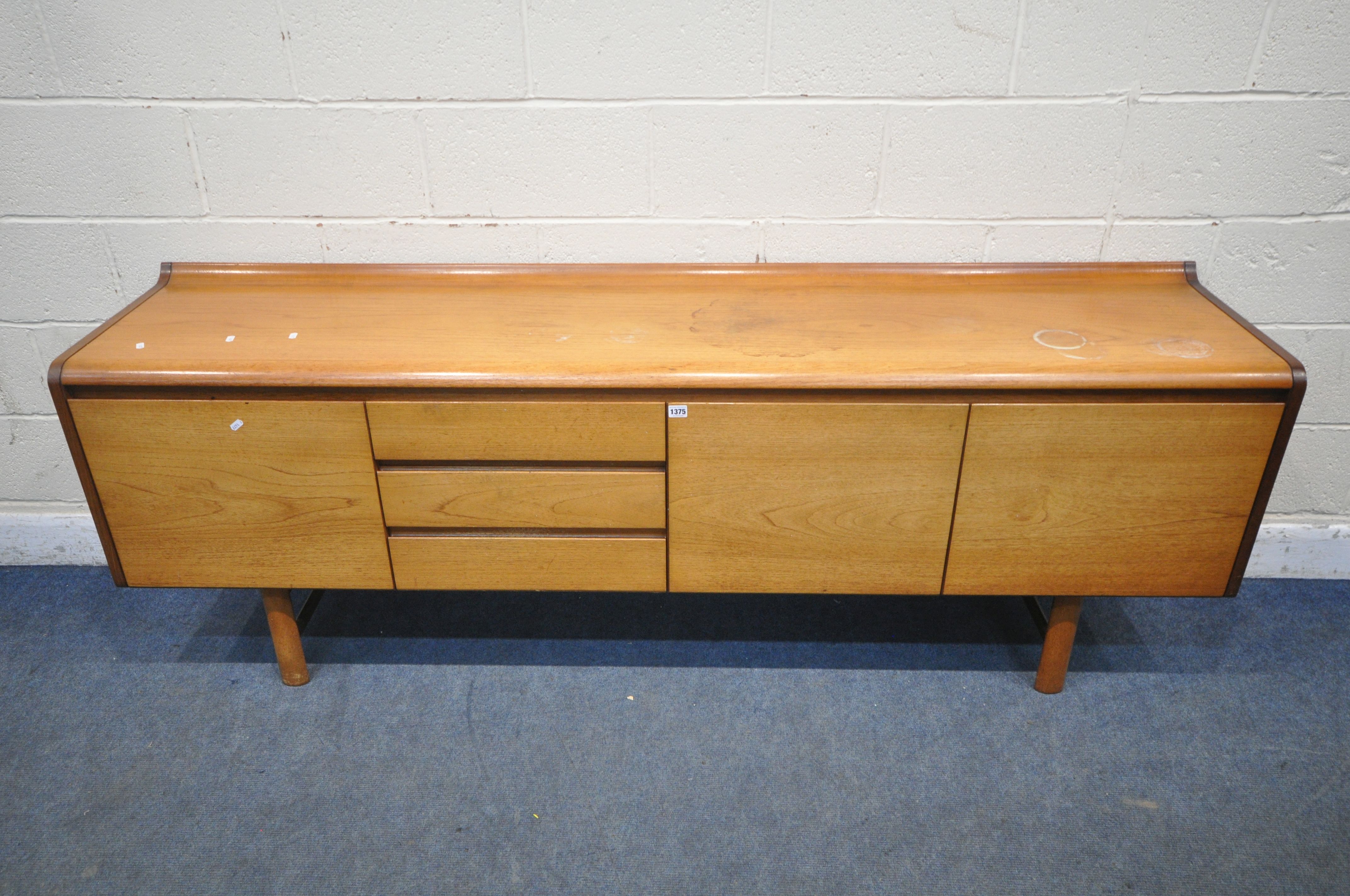 WHITE AND NEWTON LTD, A MID CENTURY TEAK SIDEBOARD, fitted with a fall front door, double cupboard