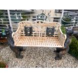 A CAST IRON BLACK FOREST STYLE GARDEN BENCH, the seat is supported by two angry black bears, the