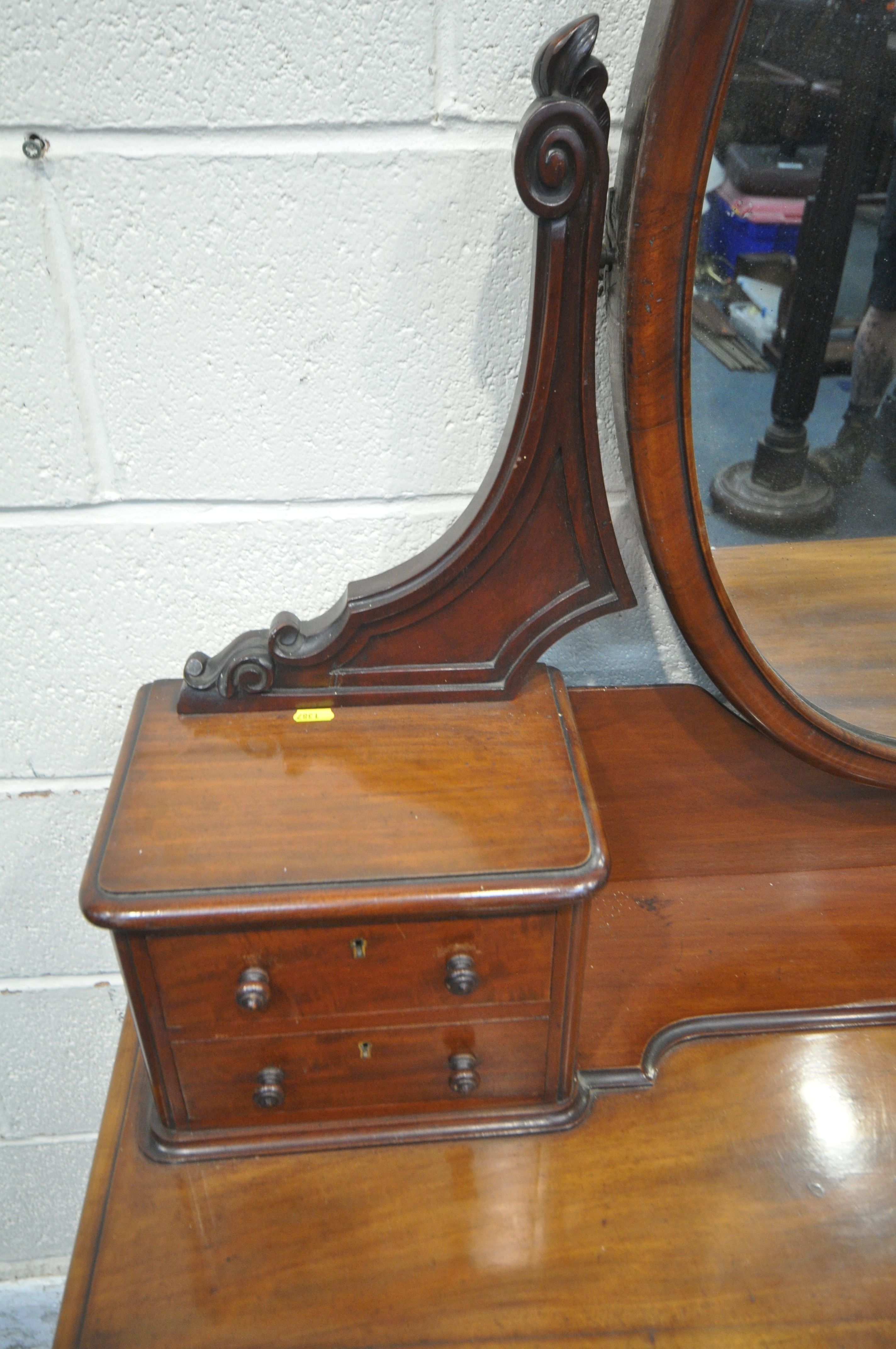 A 19TH CENTURY MAHOGANY TWIN PEDESTAL DRESSING TABLE, with an oval mirror, fitted with an - Image 2 of 4