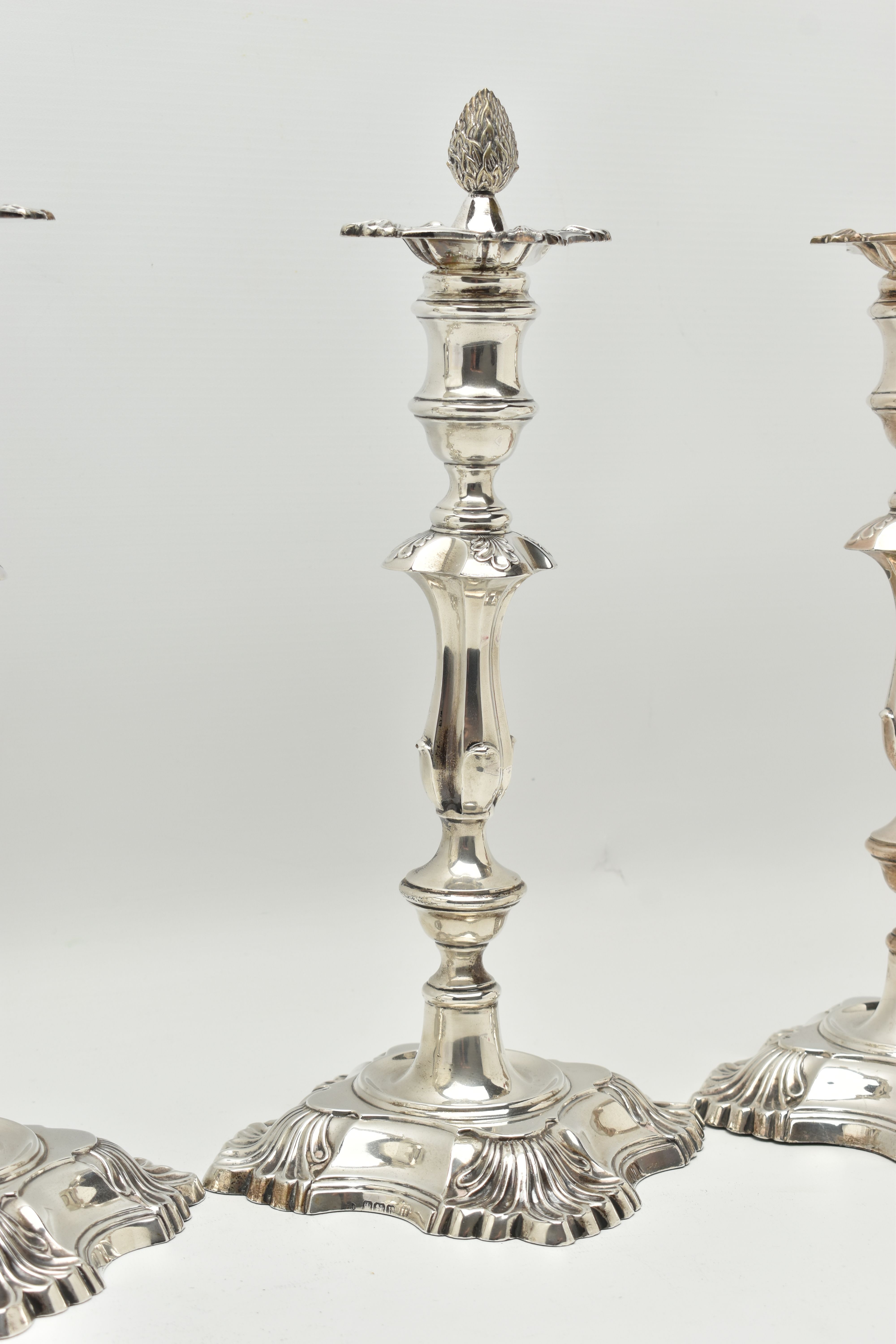 A GEORGE V SILVER SET OF FOUR CANDLESTICKS IN GEORGE II STYLE, with removable shaped square drip - Image 3 of 10