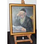 A MID 20TH CENTURY PORTRAIT OF A RABBI, a seated Rabbi is reading from a book, his glasses are